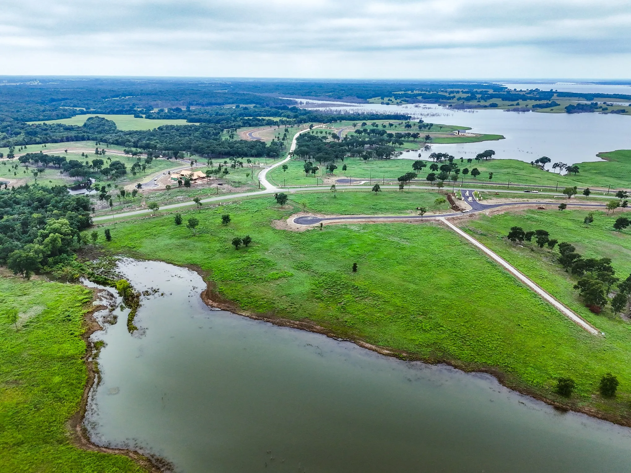 Aerial view of sparsely populated area with a large body of water