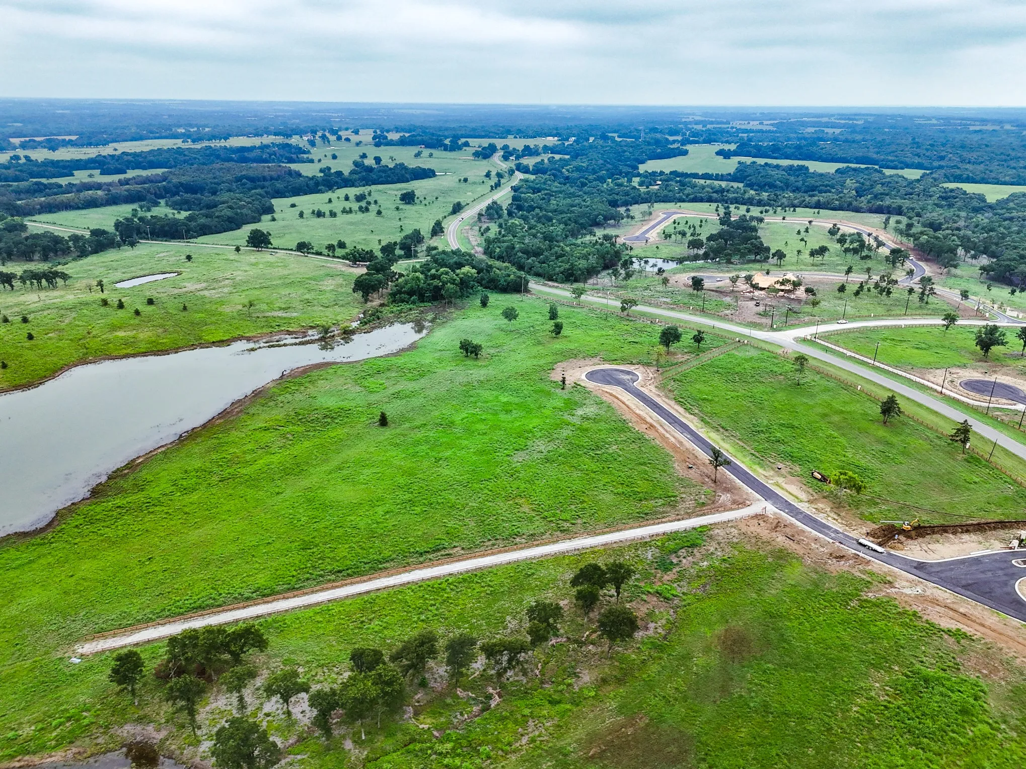 Aerial overview of property's location with rural landscape and a large body of water