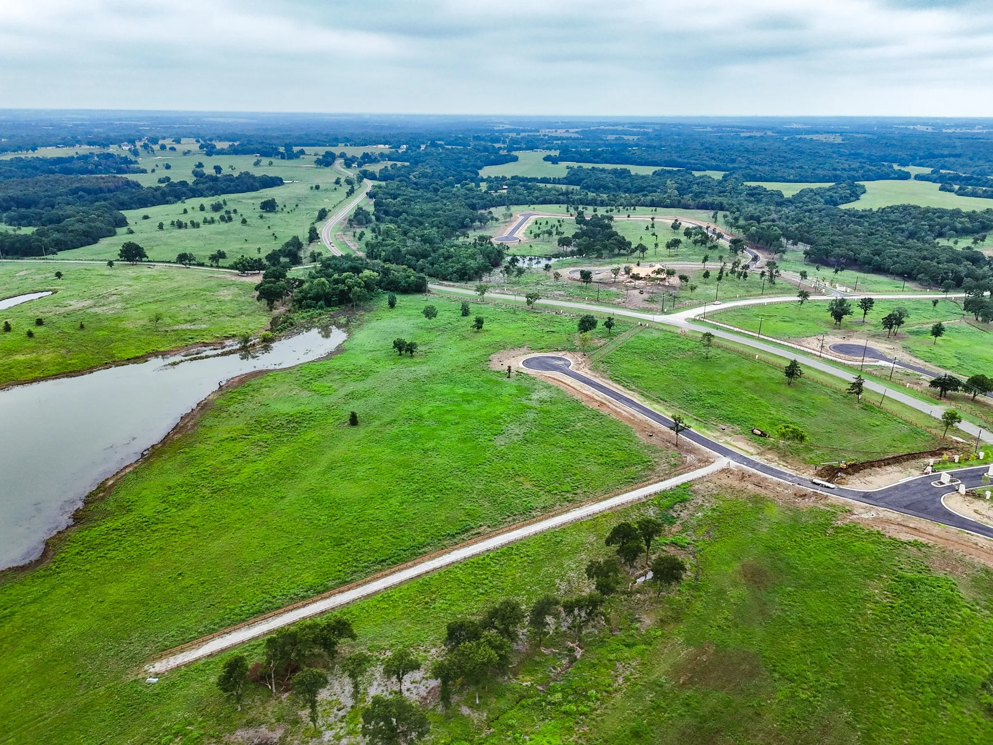 View of property location featuring a nearby body of water and rural landscape