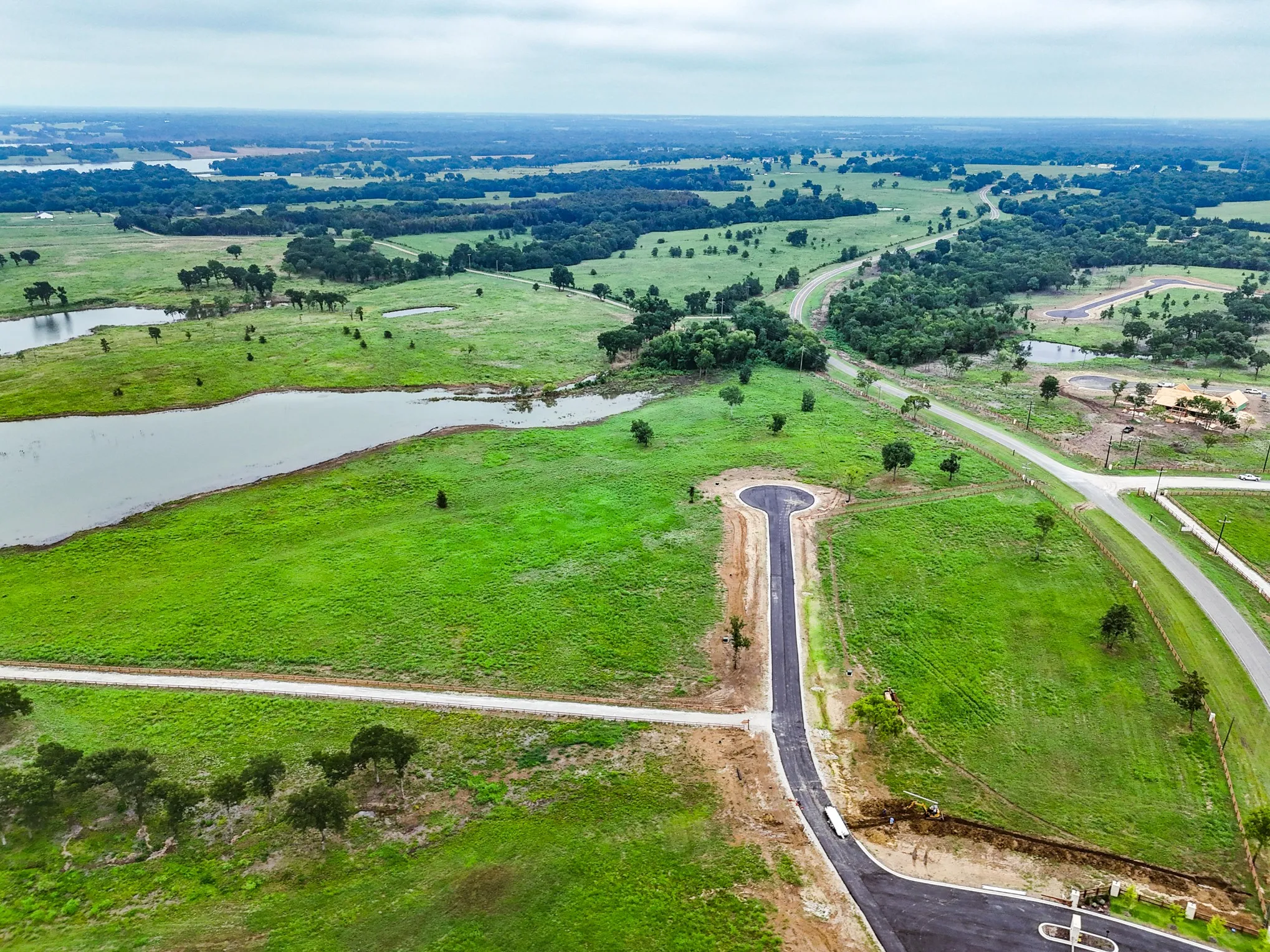 View of property location with a large body of water and rural landscape