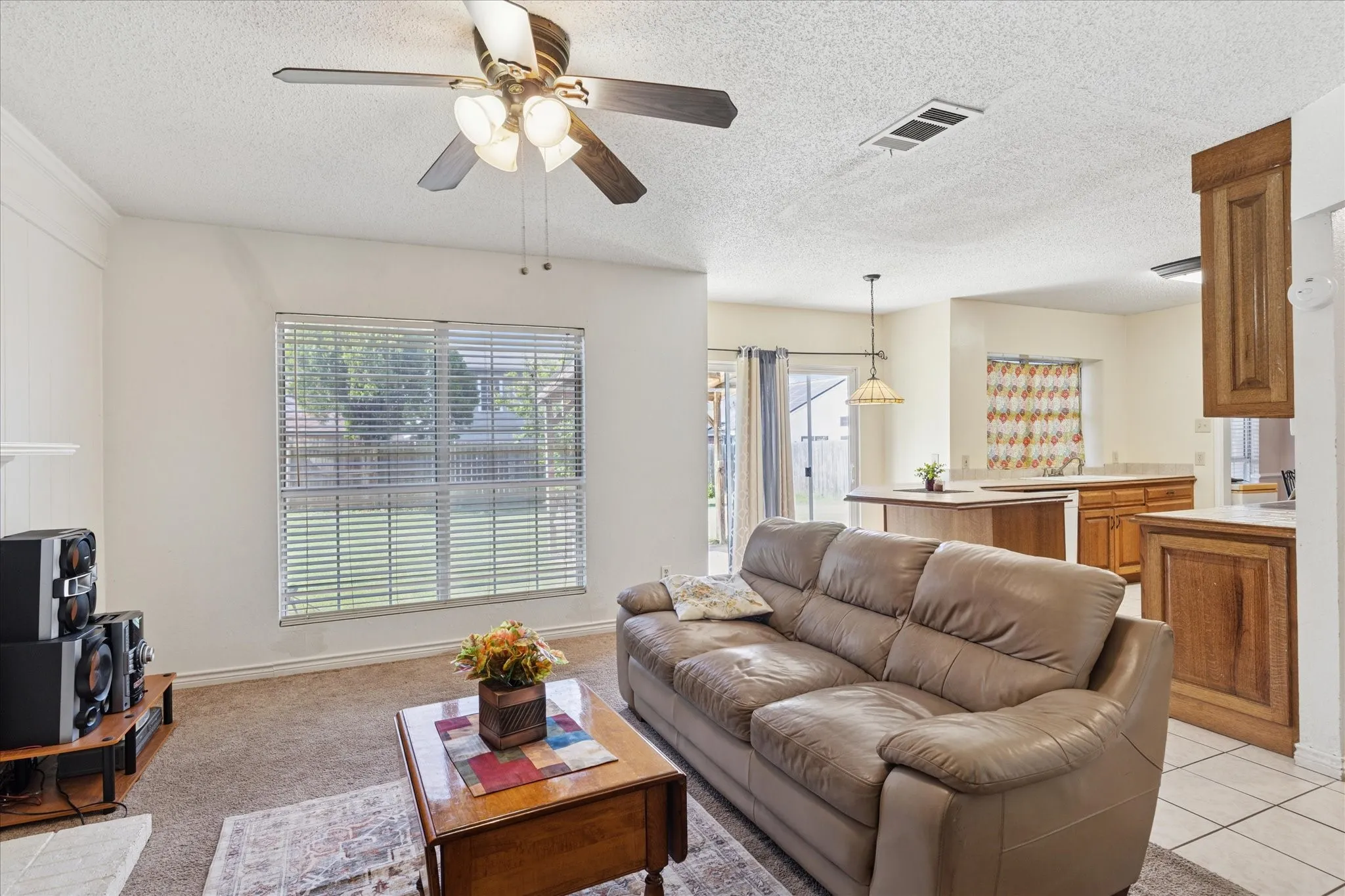 Family room off the kitchen with access to the backyard