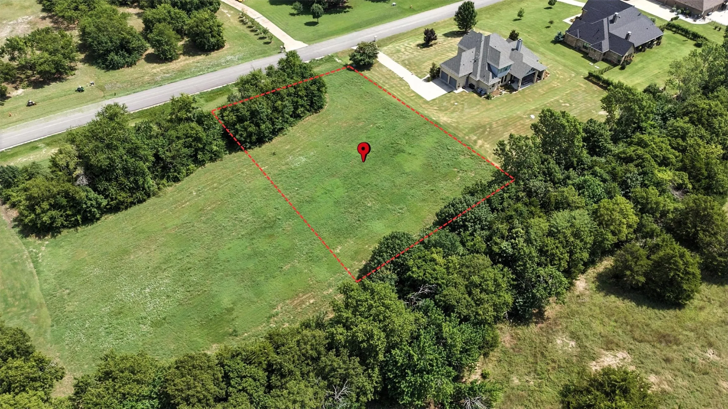 Aerial overview of property's location featuring property parcel outlined