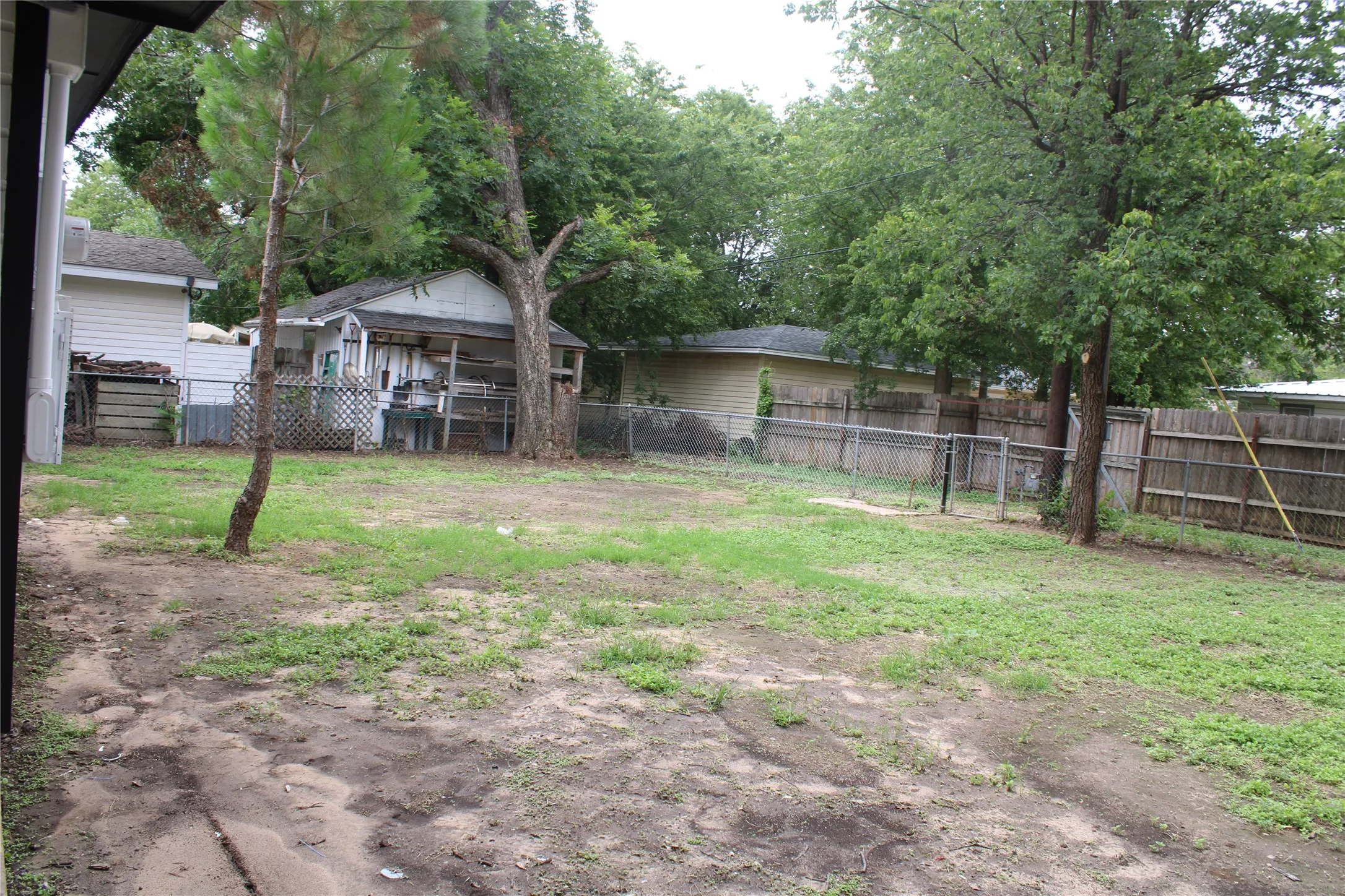 View of fenced backyard