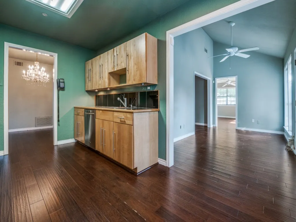 Kitchen flows into the formal dining room and flex space.