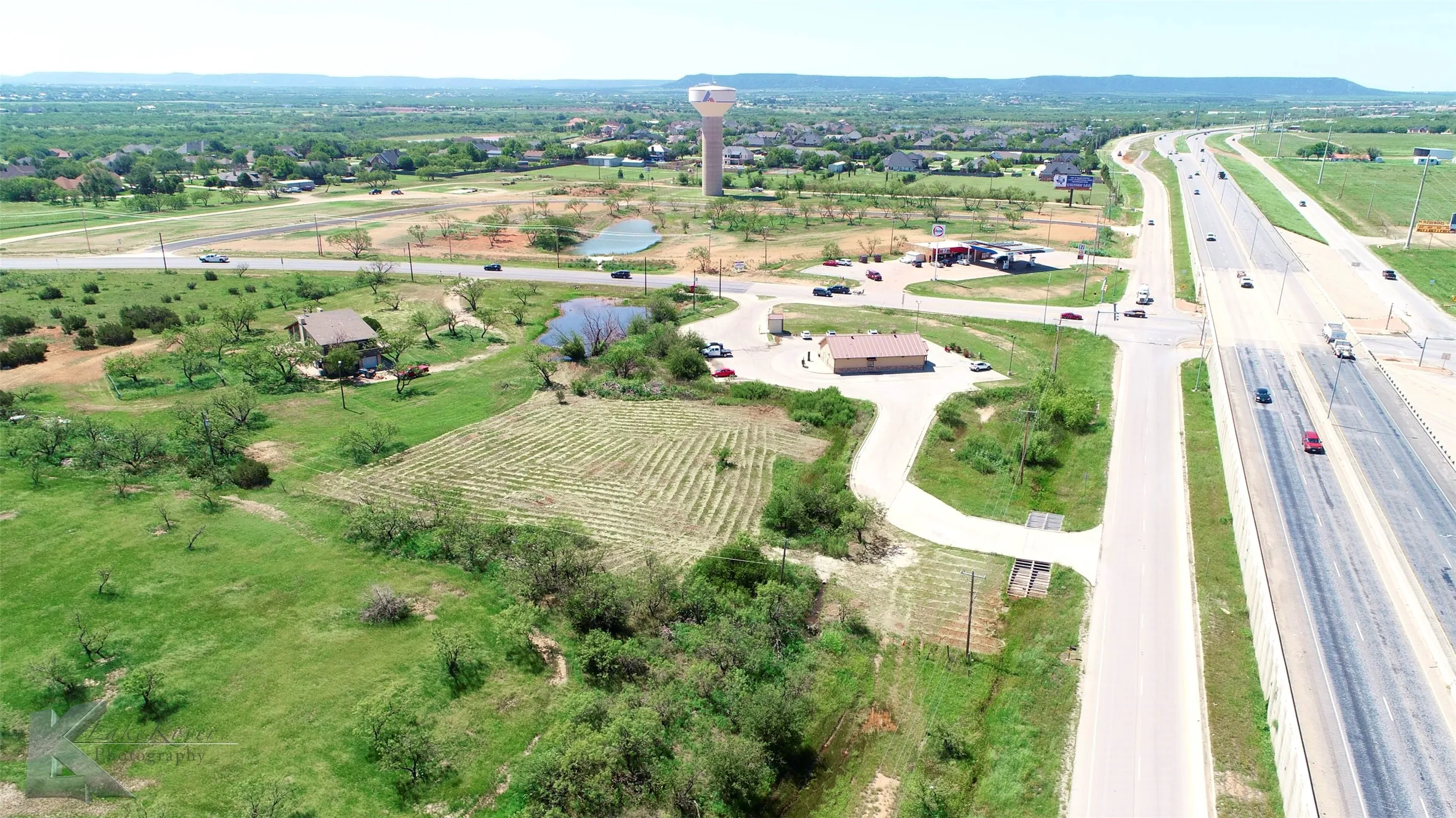 Aerial view of property's location with rural landscape and a major roadway