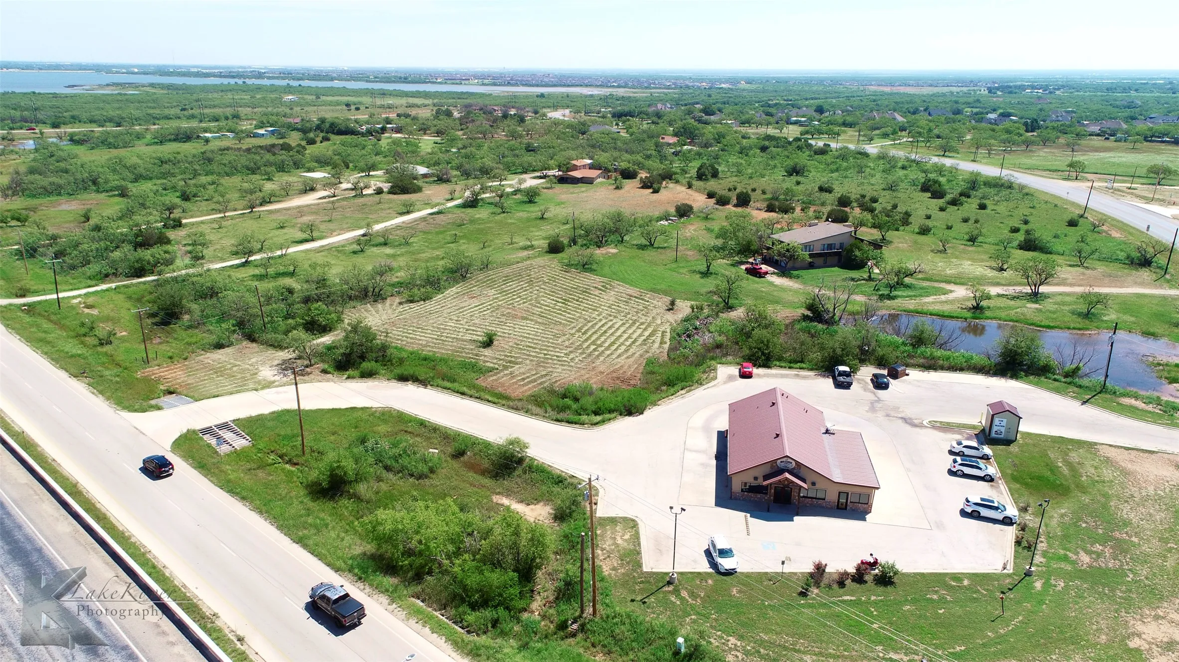 Overview of rural landscape featuring a nearby body of water