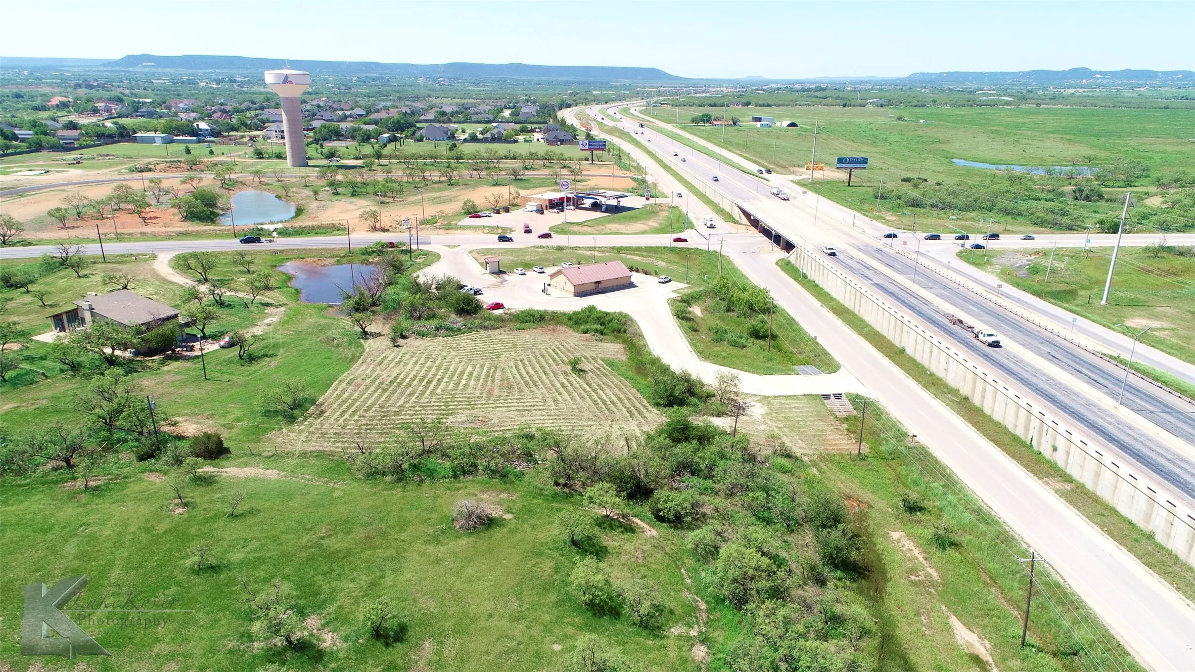 Aerial overview of property's location with rural landscape and a water and mountain view