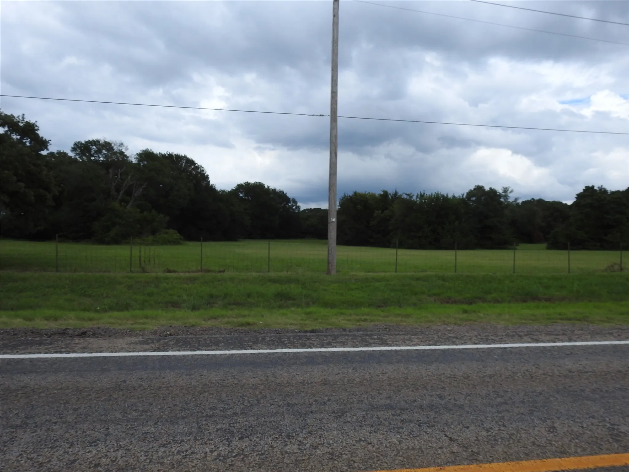 This picture shows the cleared area and heavy Oak trees and other native trees on the East side.