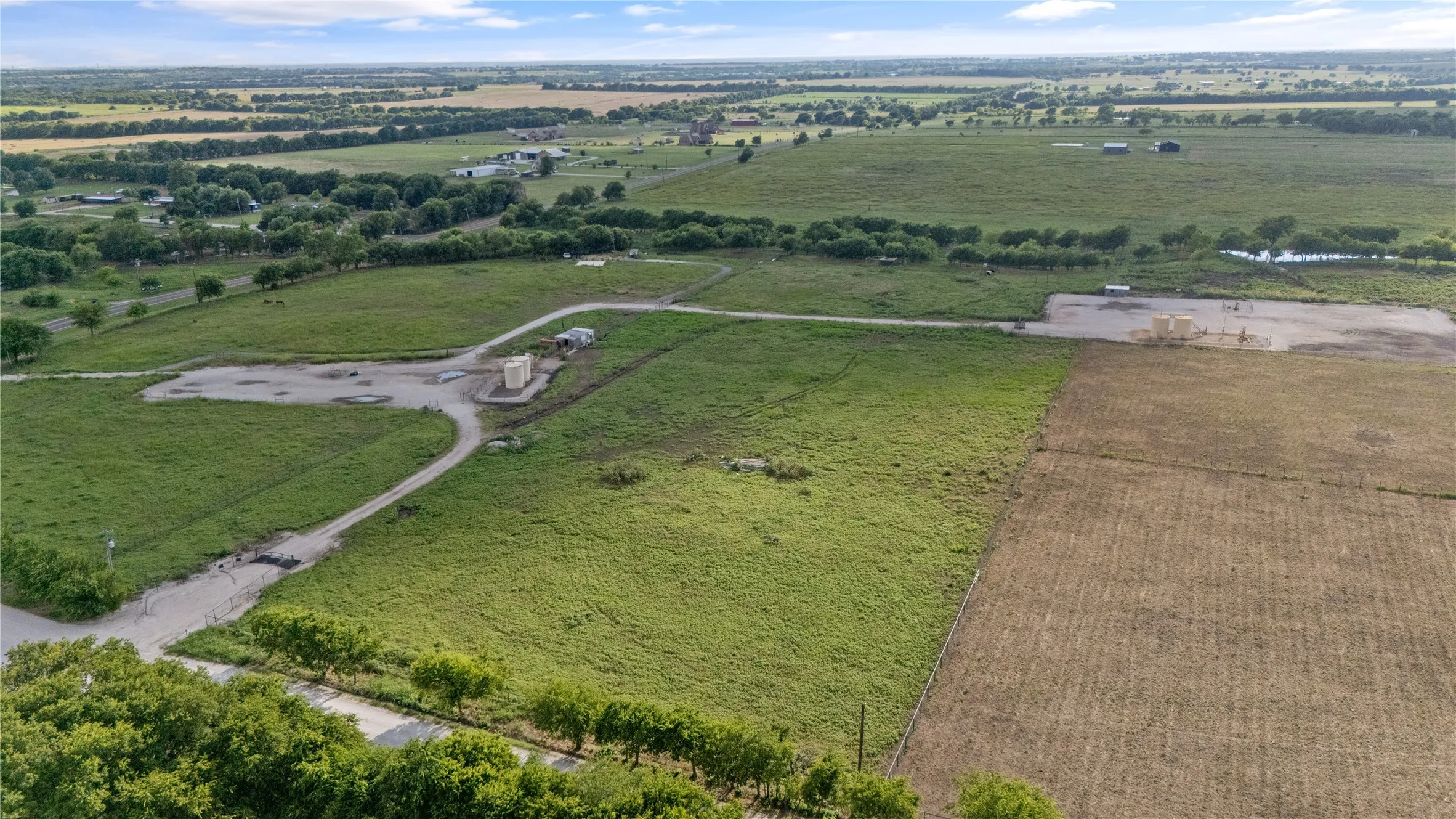Aerial view of property's location featuring rural landscape and a pastoral area