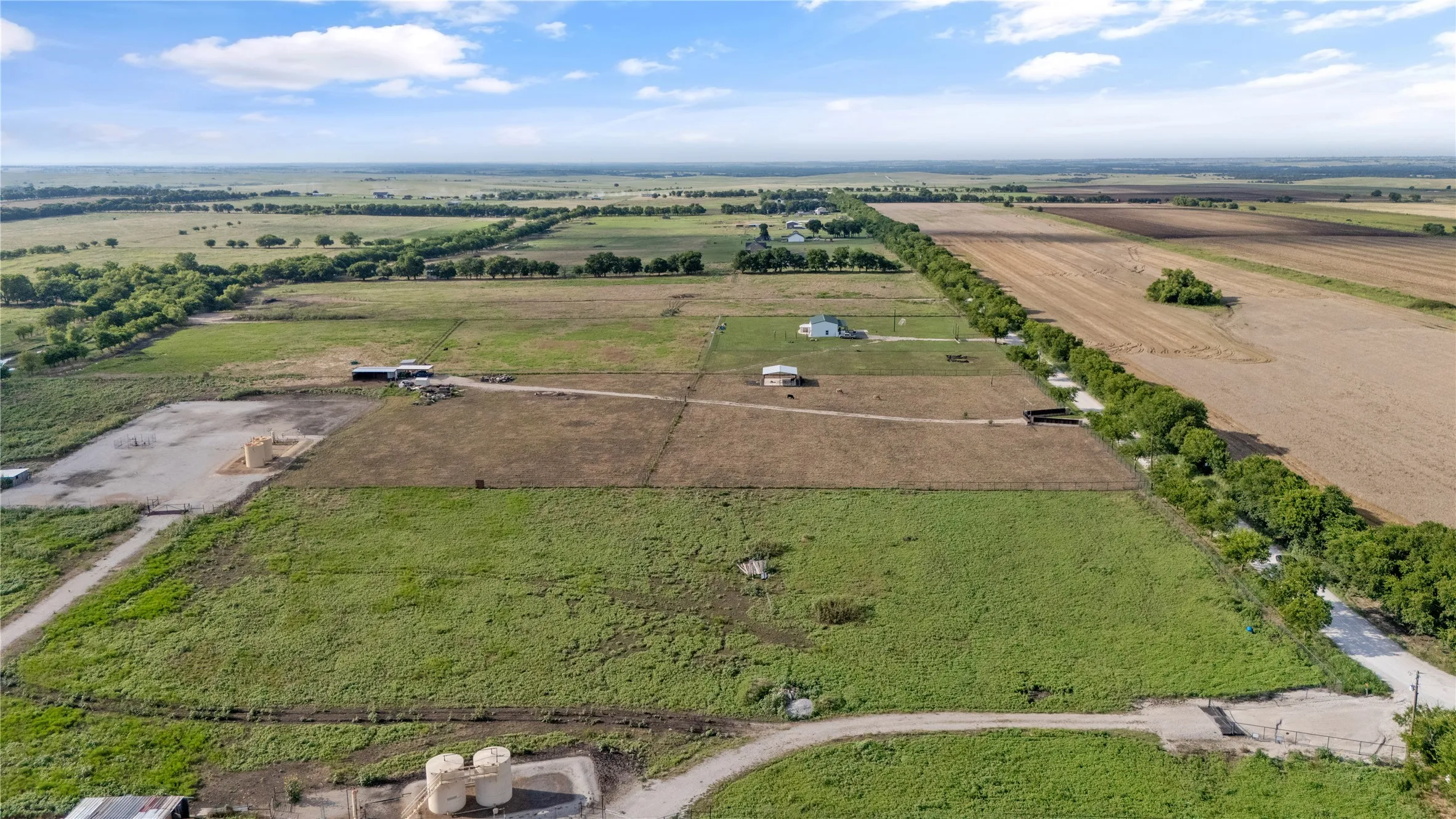 Aerial view of property's location with rural landscape and rows of crops