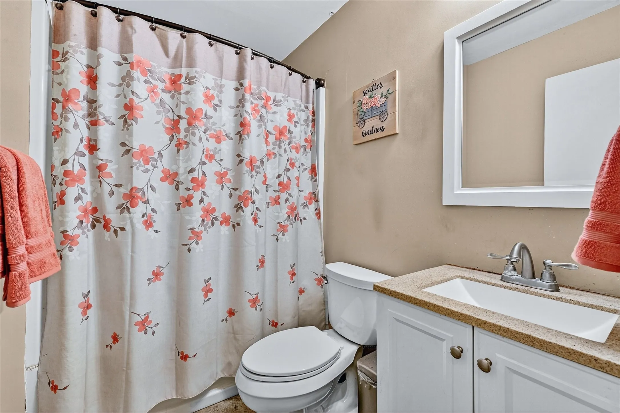Full bathroom featuring vanity and curtained shower