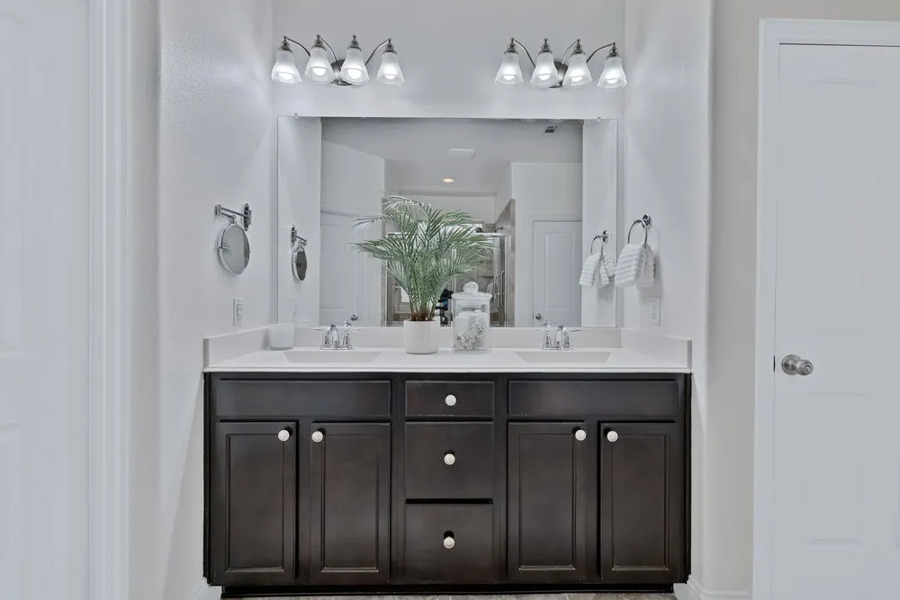 Primary Full bath with double vanity and an oversized stall shower