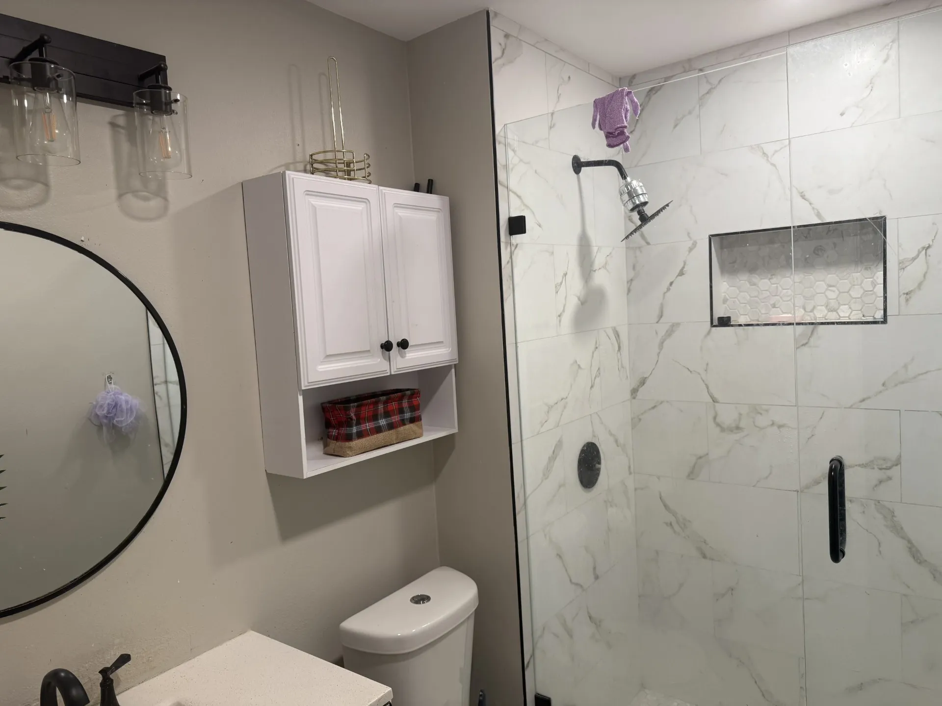 Full bath with a stall shower and vanity