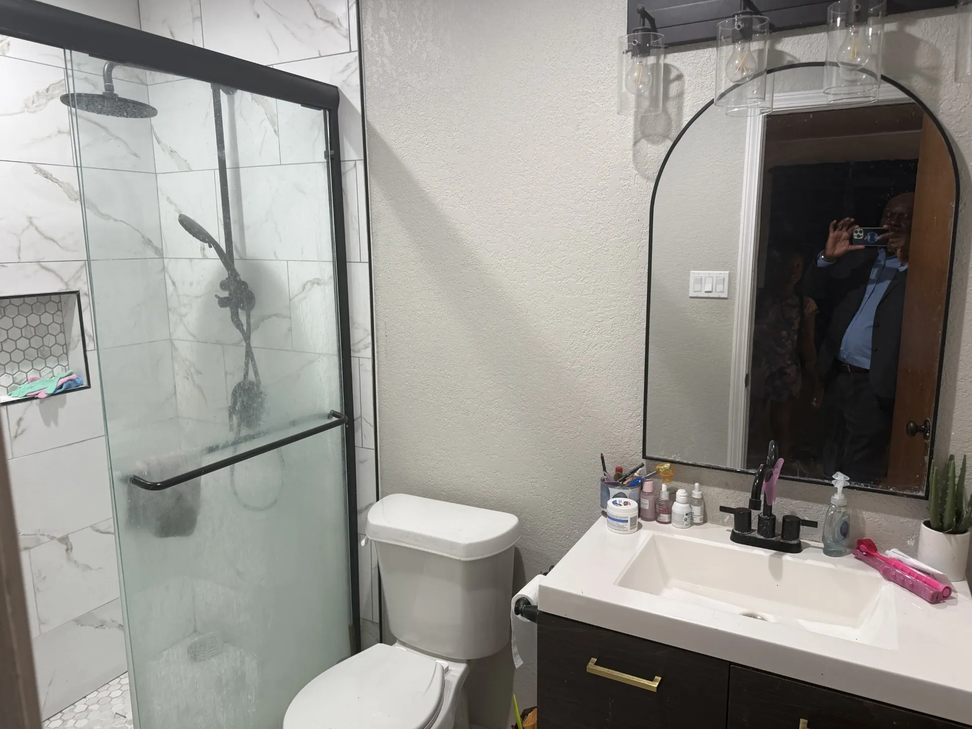 Bathroom with vanity and a shower stall