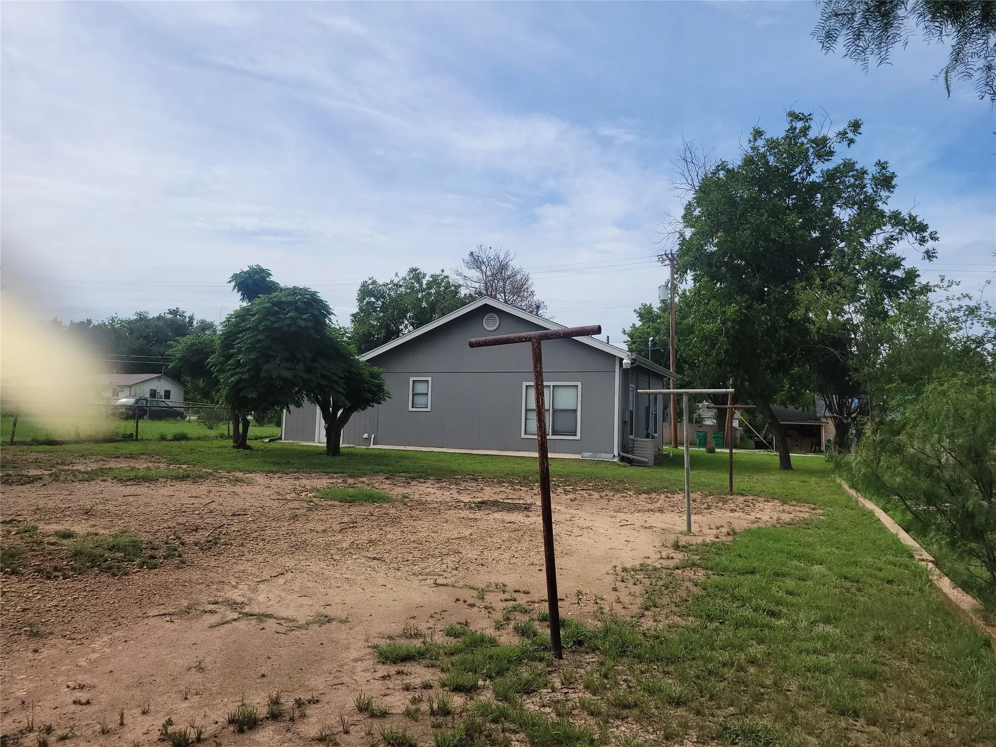View of side of home featuring a playground