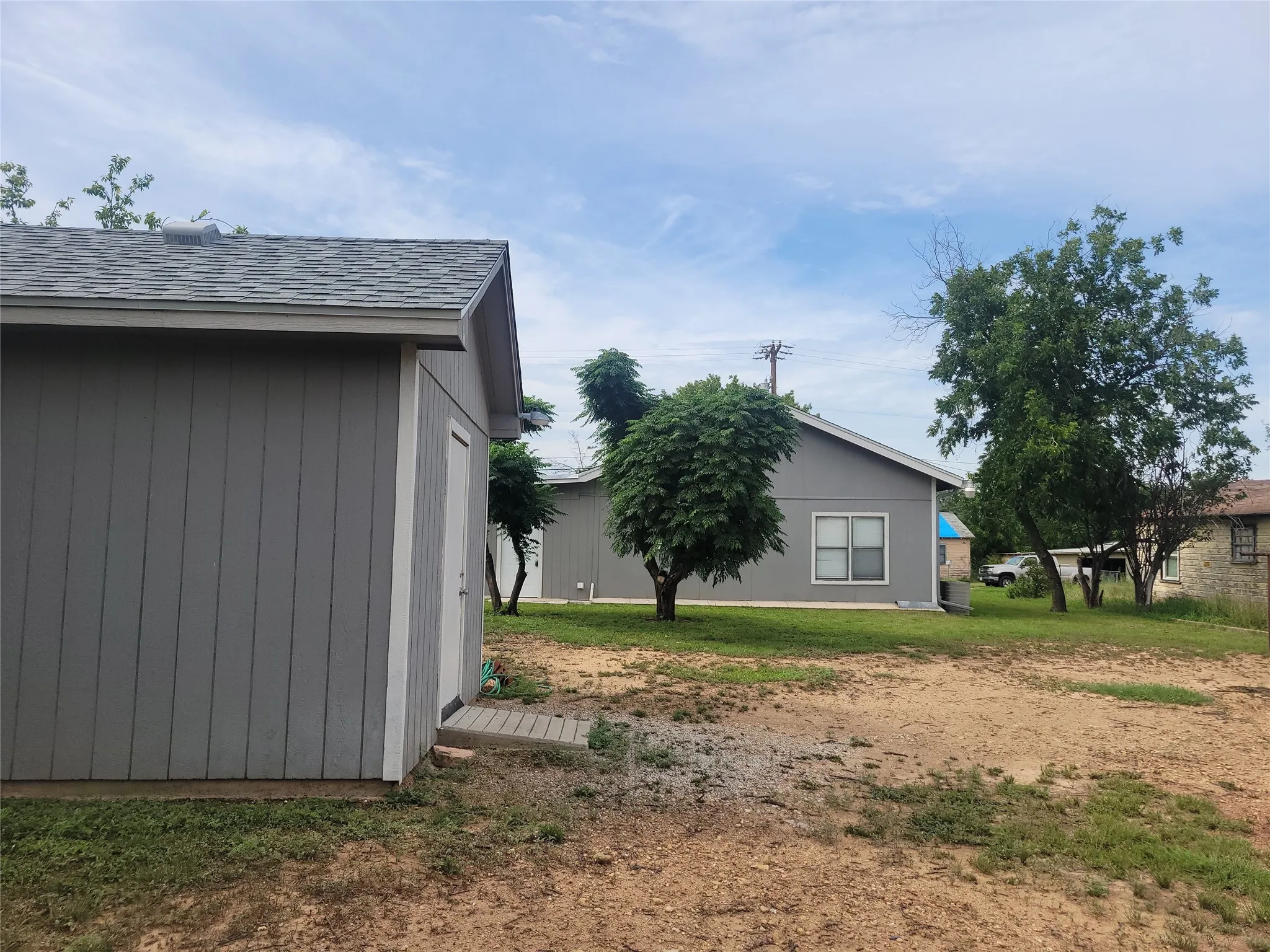 View of property exterior with roof with shingles