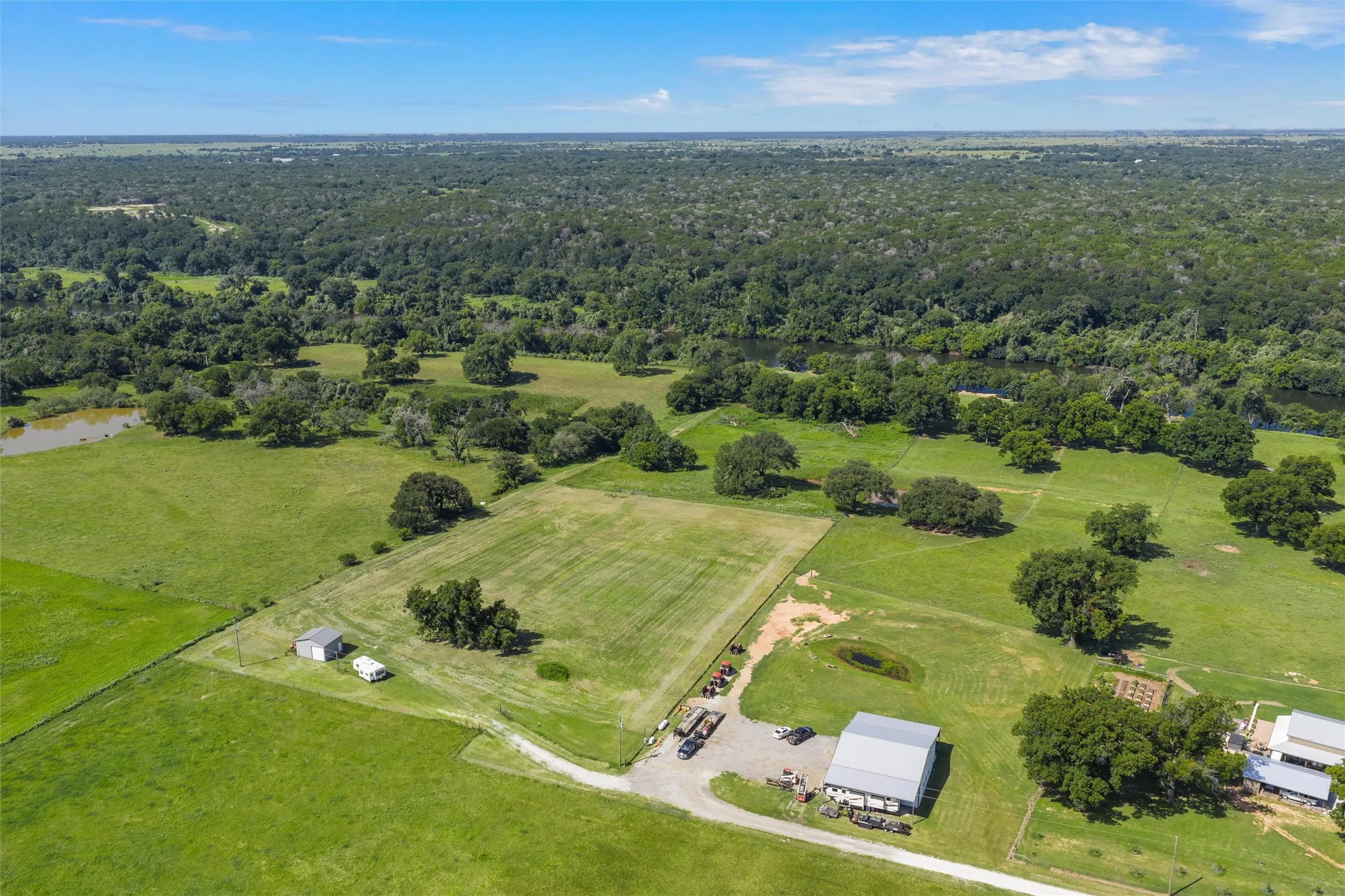 View of property location with a forest and rural landscape