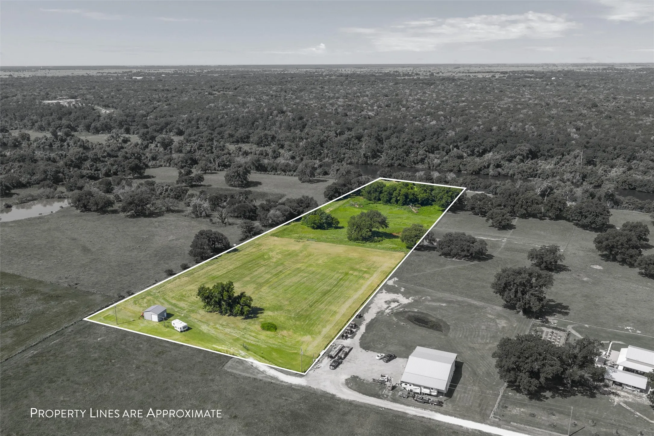 View of property location with property parcel outlined and a heavily wooded area