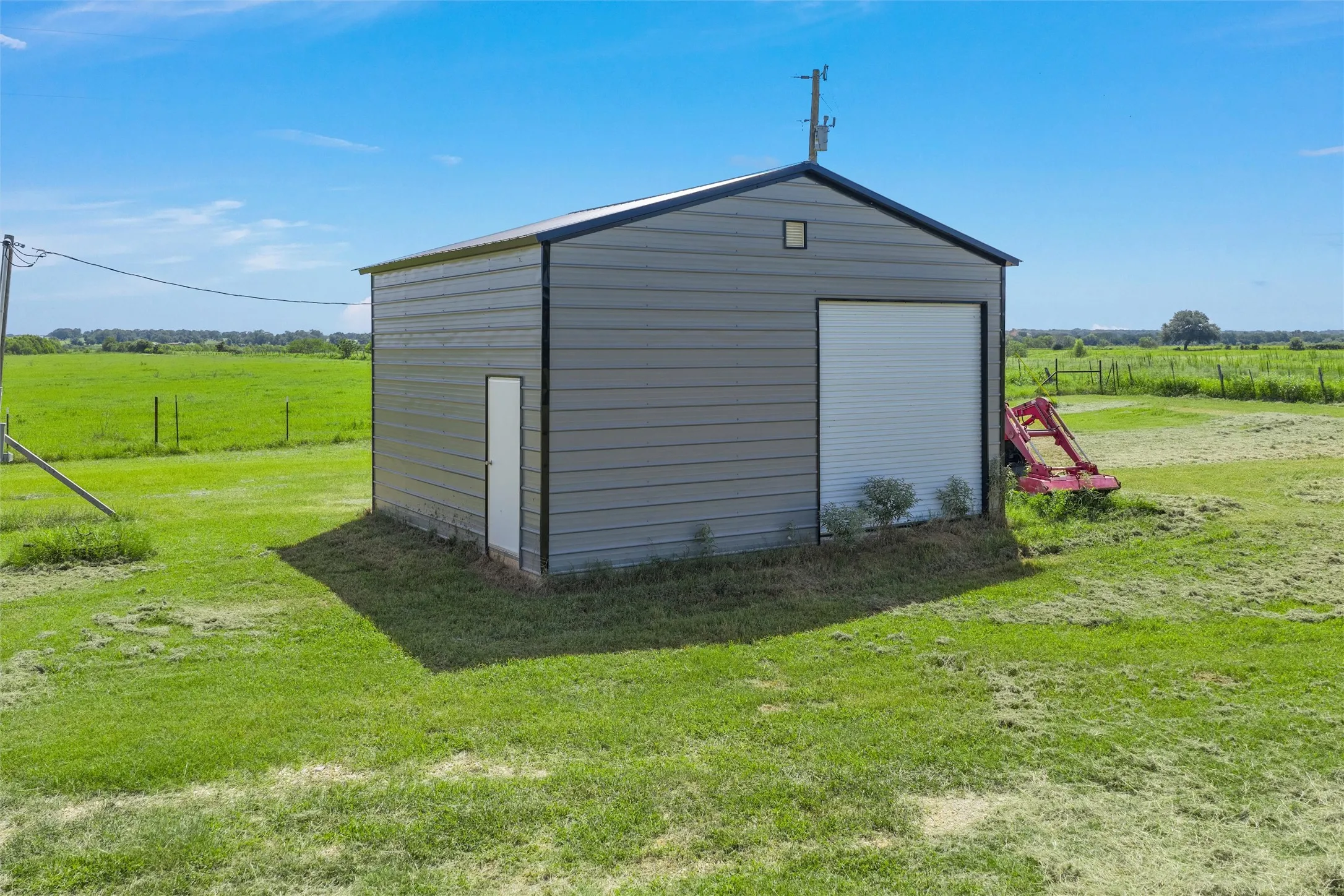 View of outdoor structure with a view of rural / pastoral area