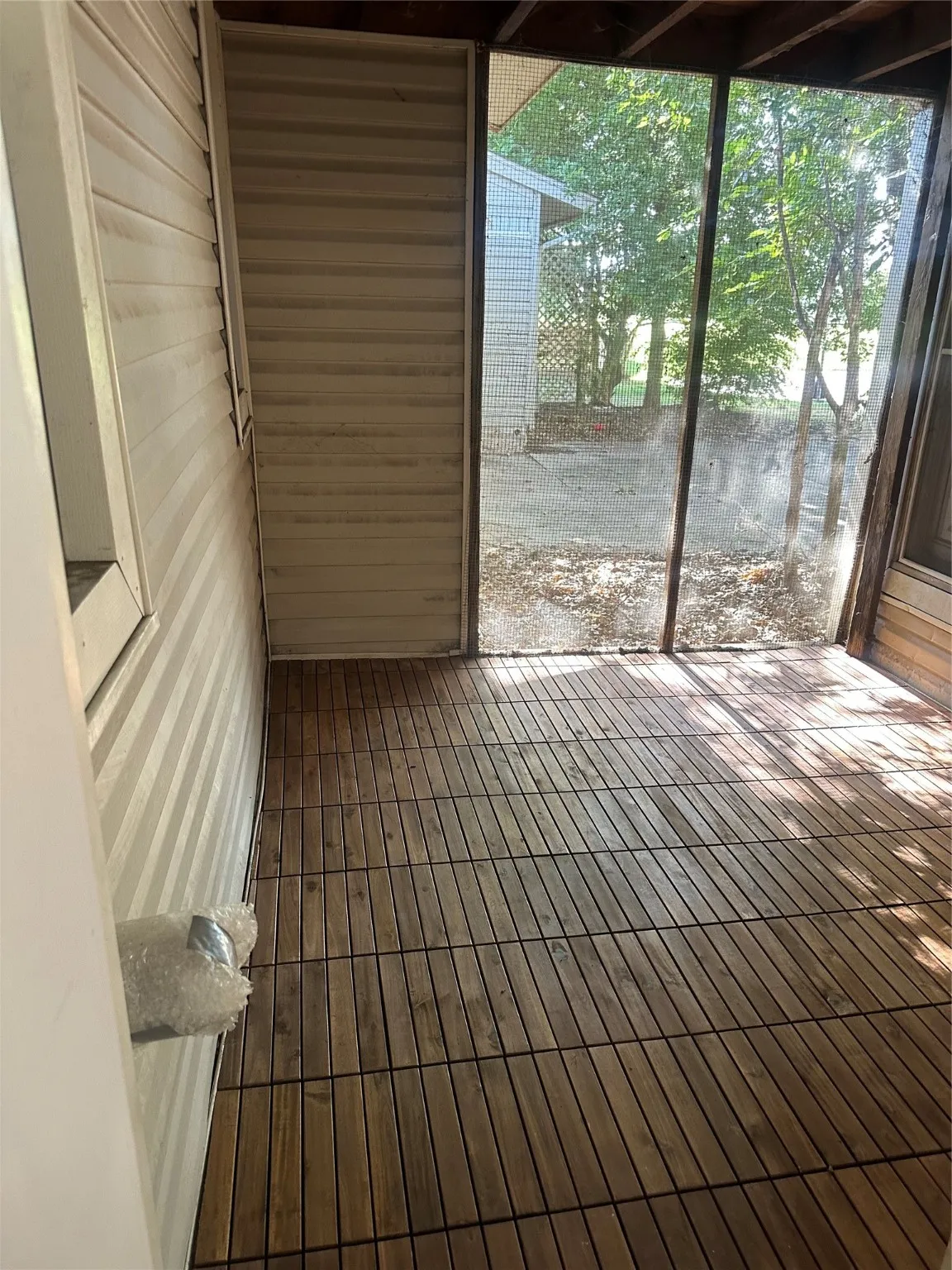 Unfurnished sunroom featuring plenty of natural light