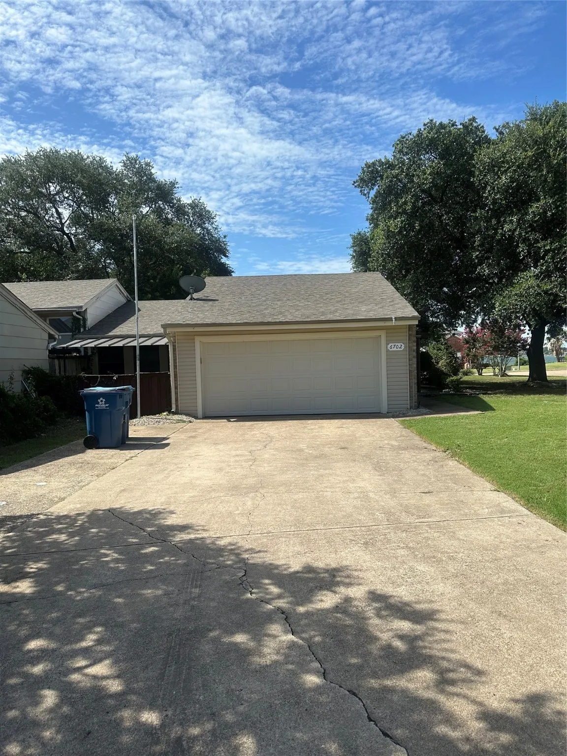 Garage featuring driveway
