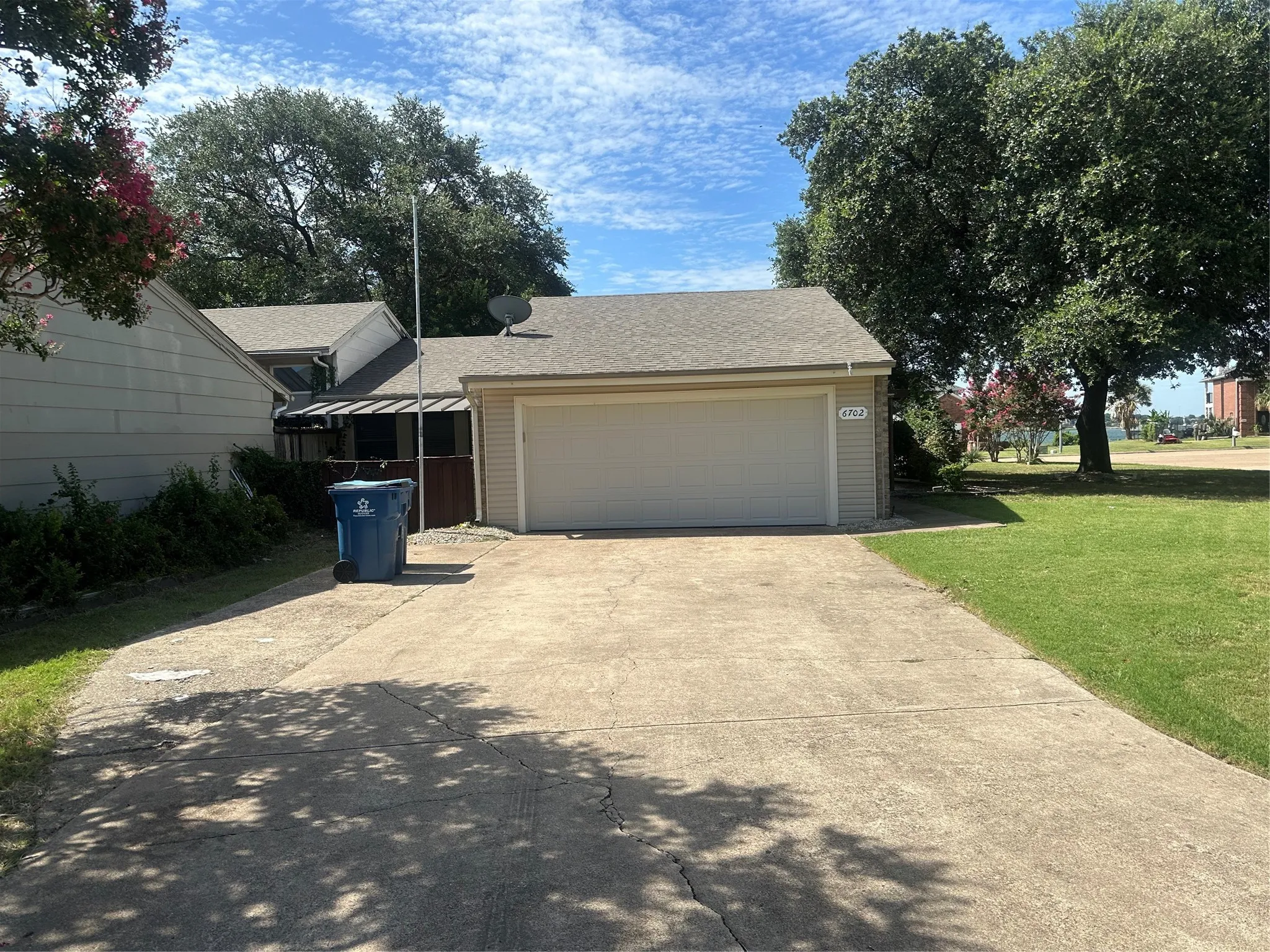 Garage featuring driveway