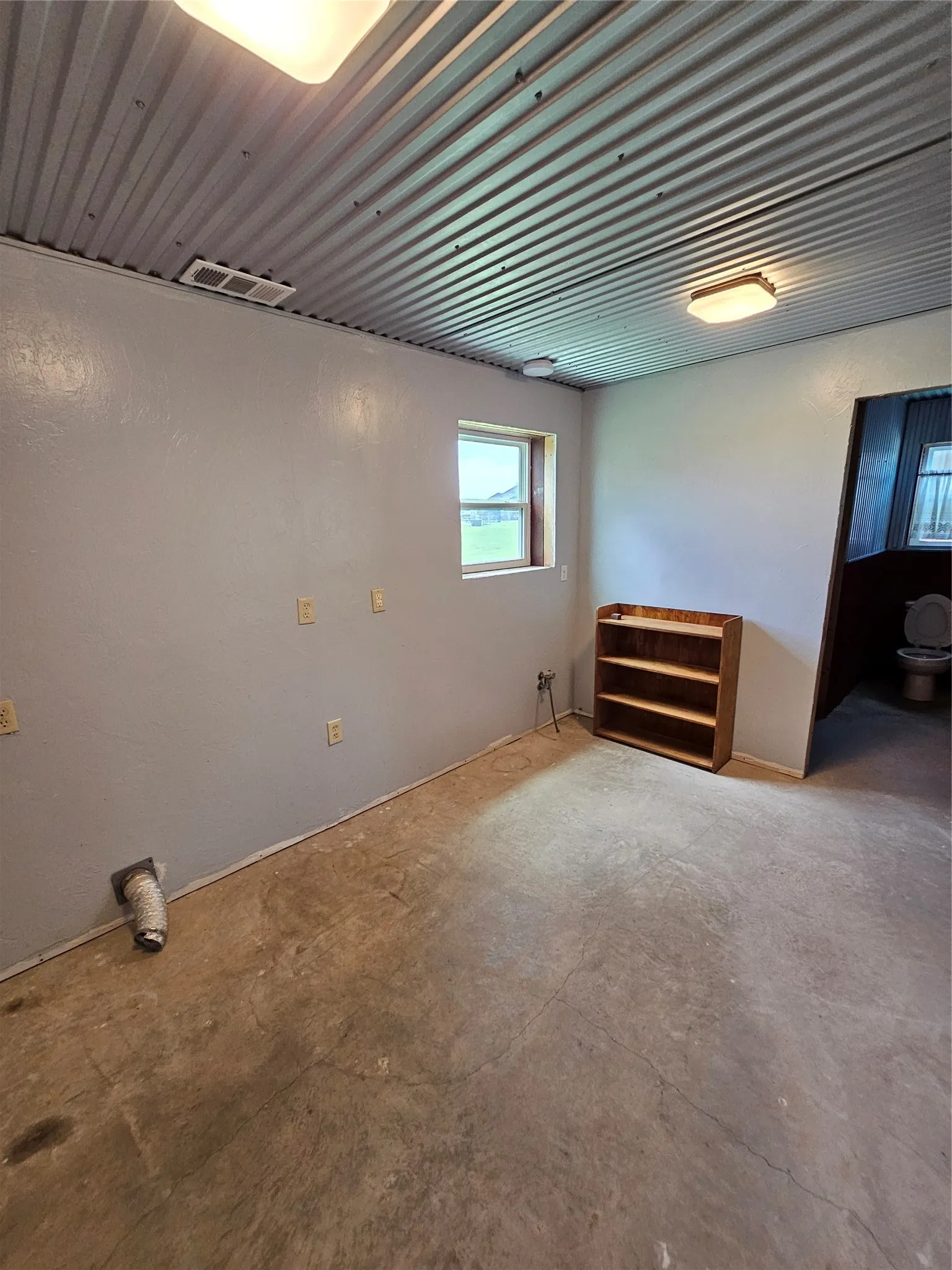 Laundry room located in guest house.