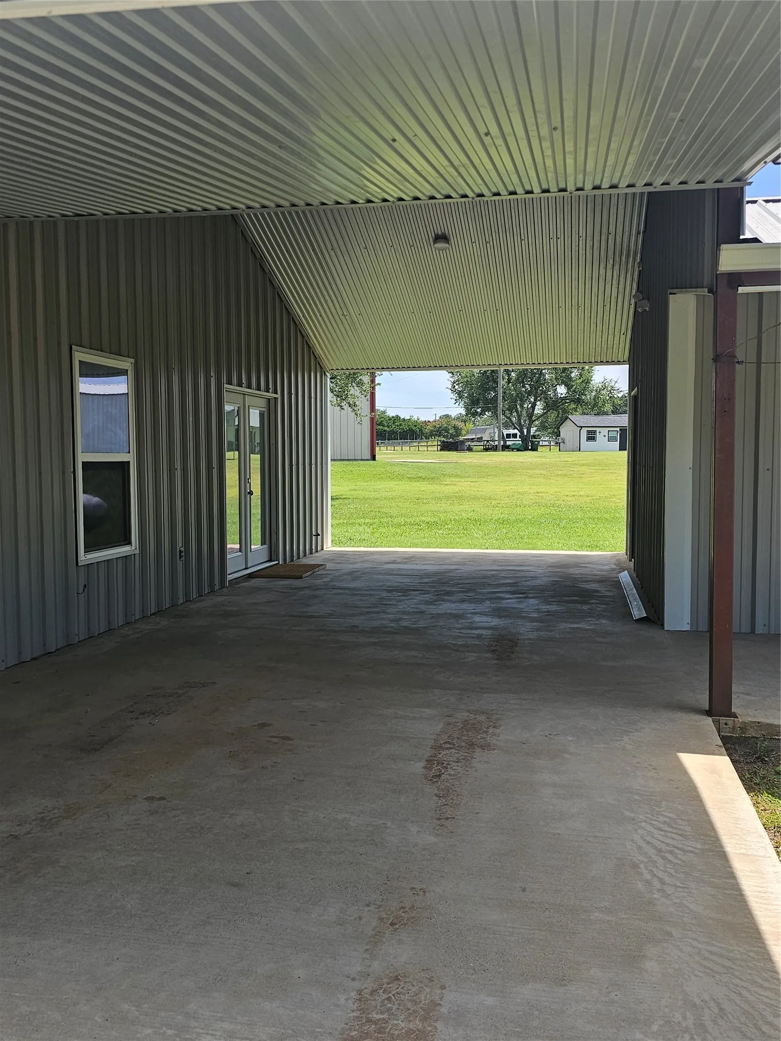 Breezeway with main house on left and guest house on right