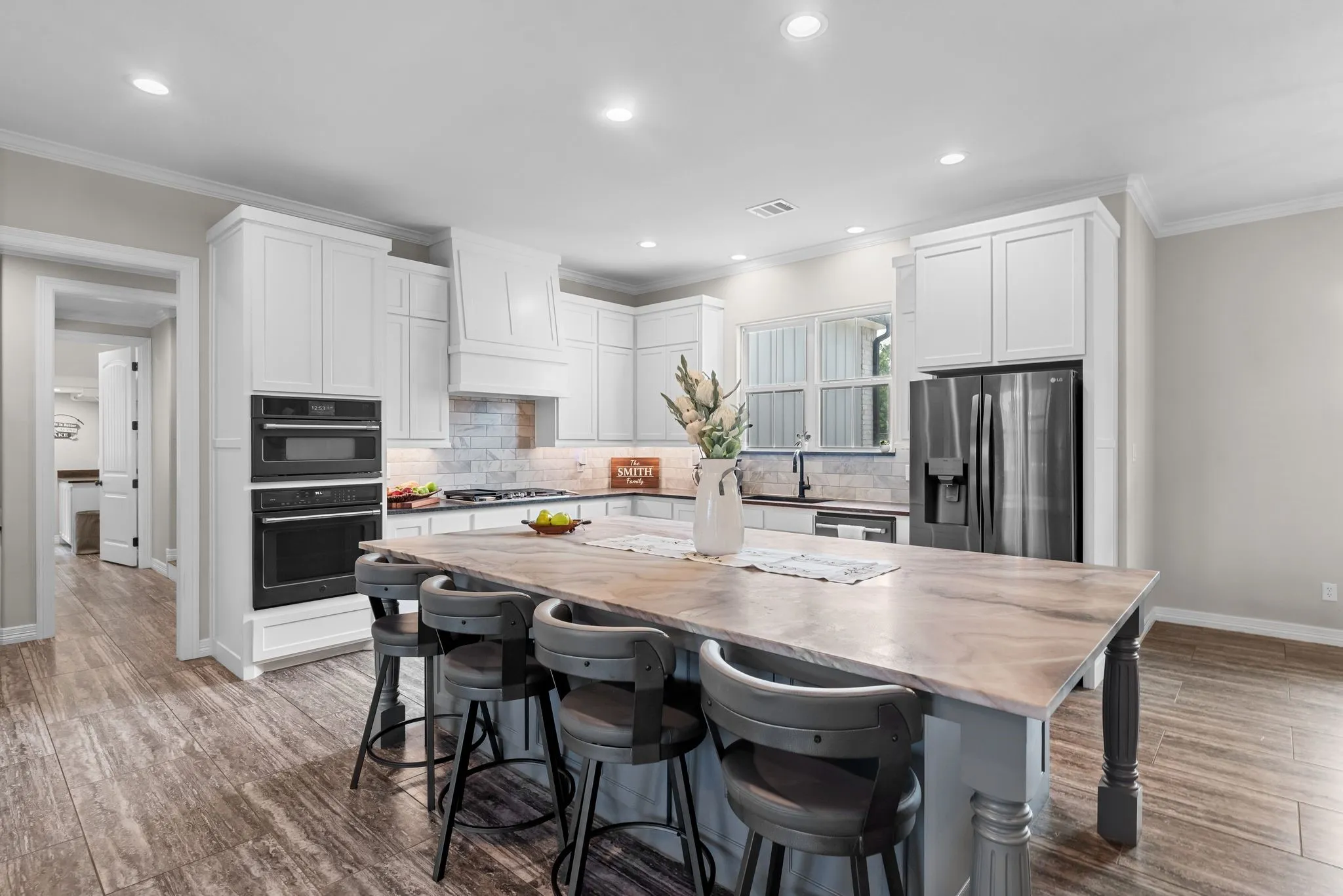 The heart of the home... this stunning kitchen with large granite topped island provides additional seating