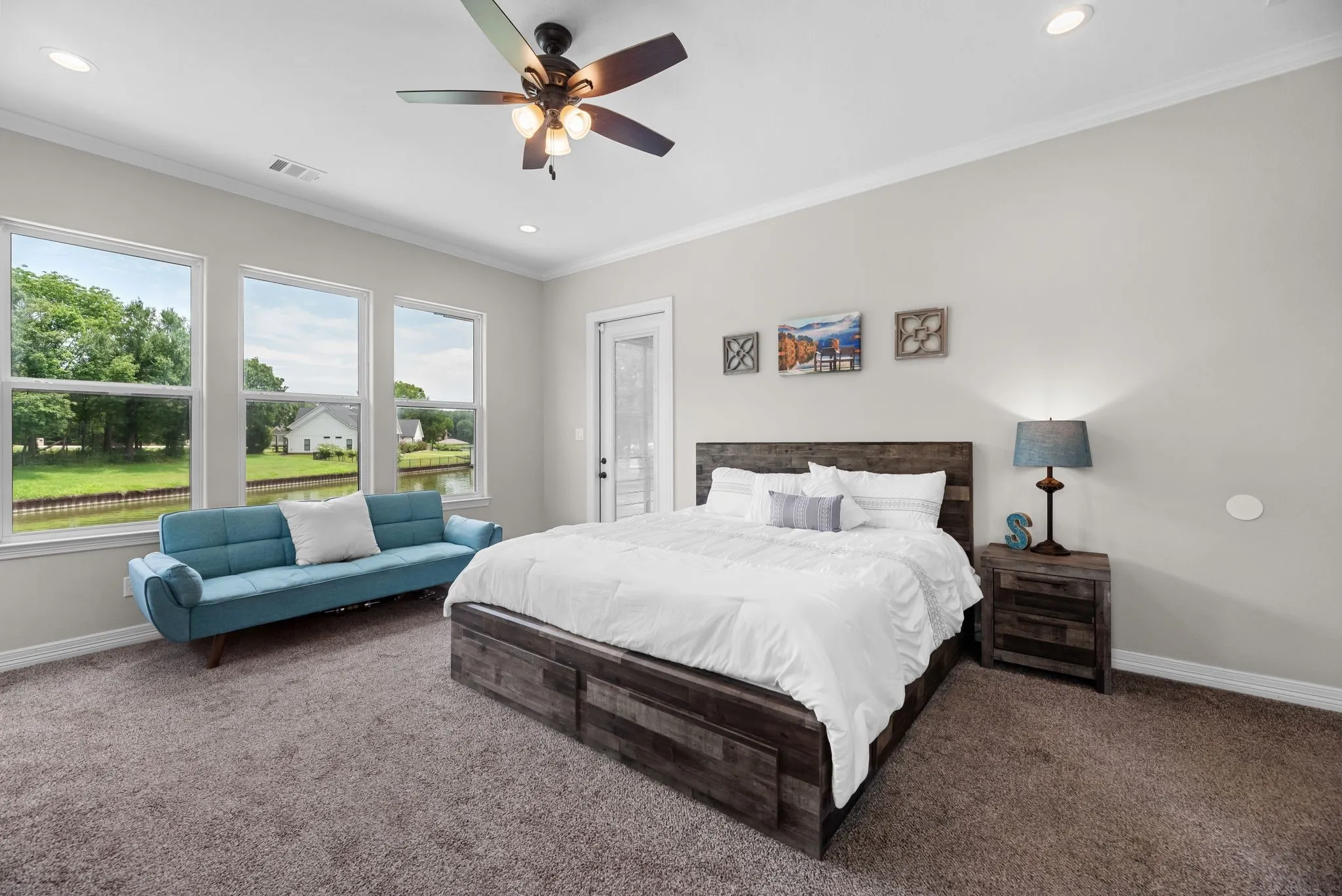 The primary suite is an oasis...with view overlooking the water and a private exit to the patio,