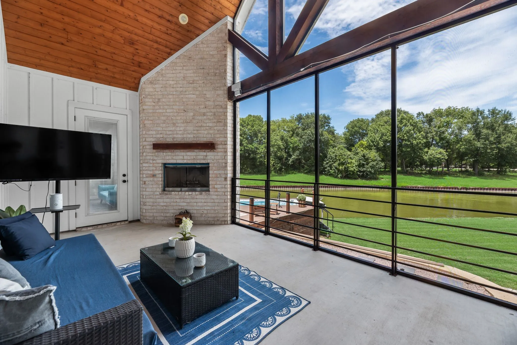 You'll find a true outdoor living space complete with screened in patio and fireplace!