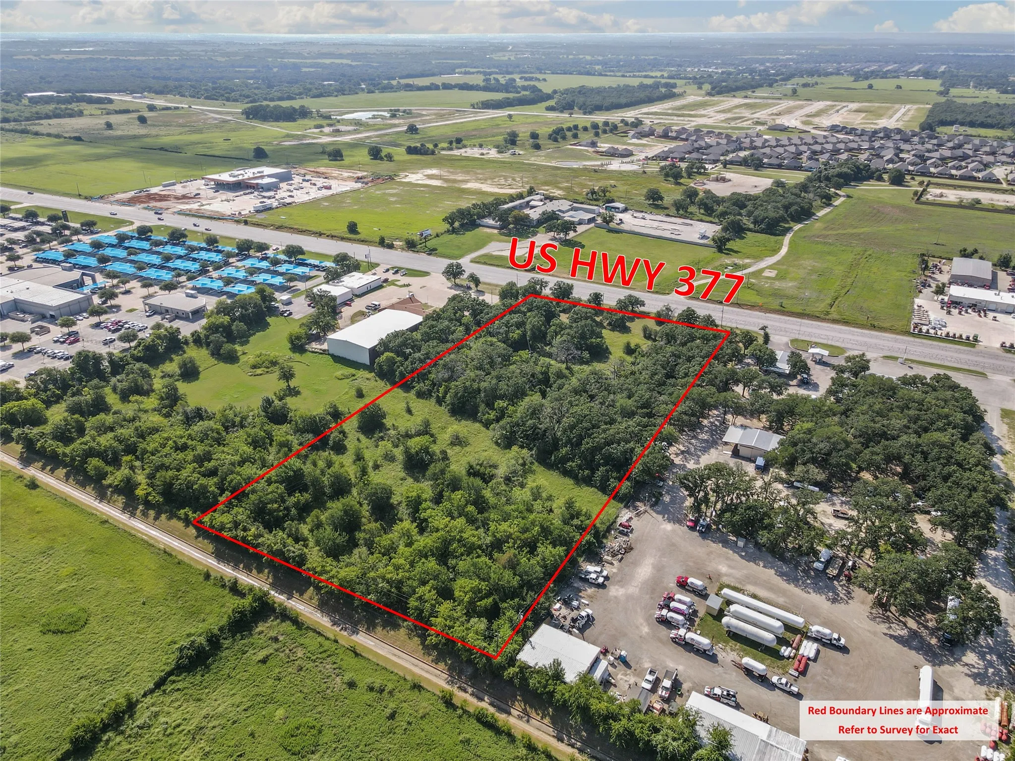 Aerial view of property and surrounding area with property boundaries highlighted