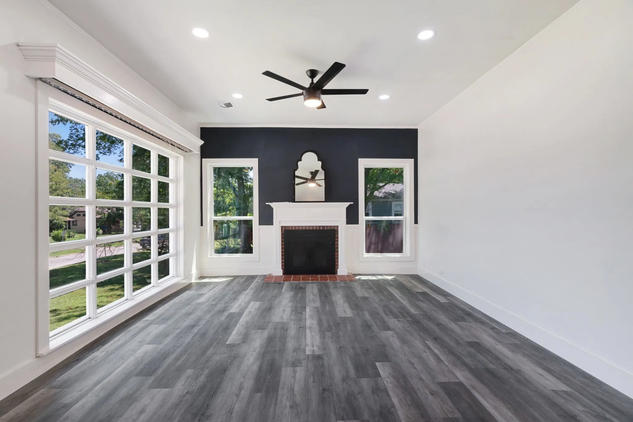 living room with a fireplace, a ceiling fan, dark wood-style floors, and recessed lighting