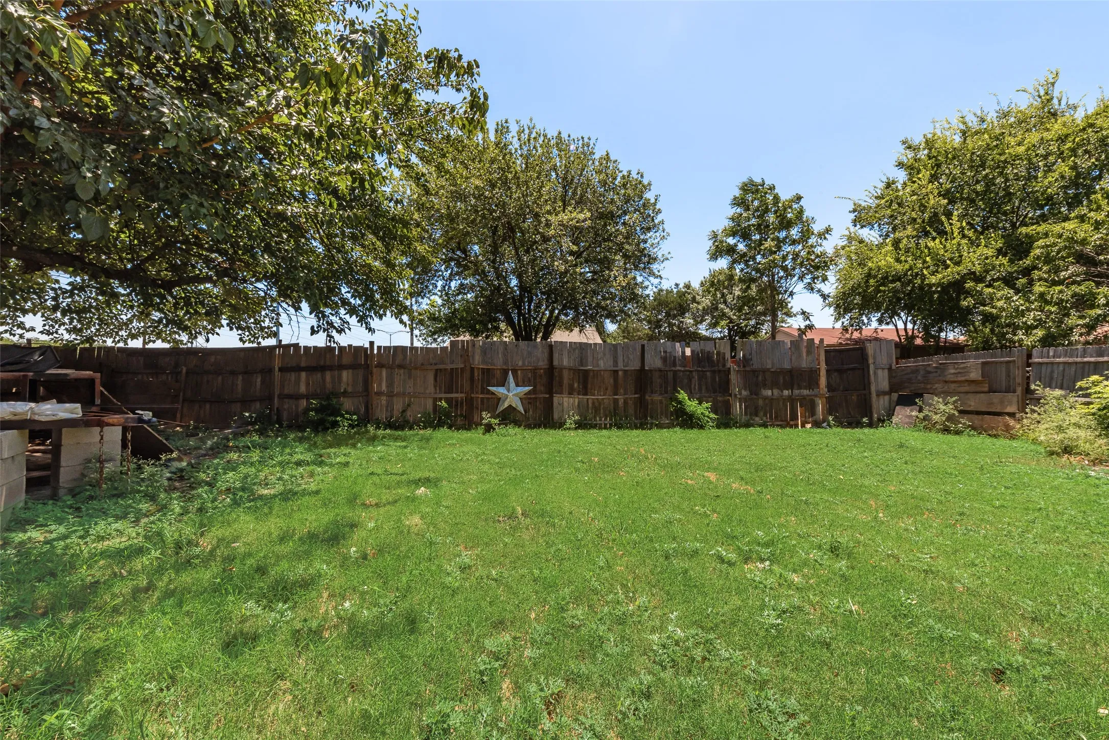 View of fenced backyard