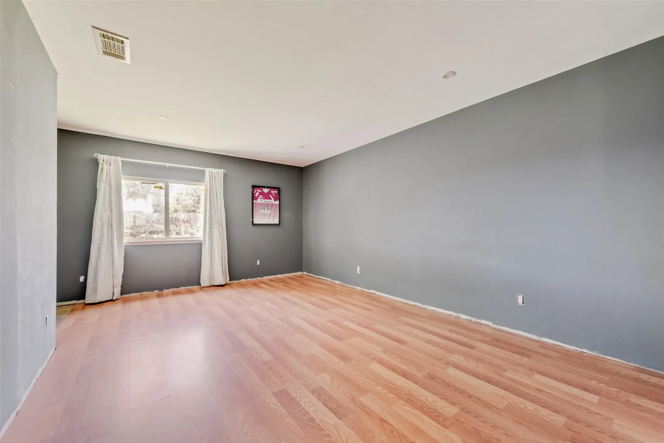 Empty room featuring light wood finished​​‌​​​​‌​​‌‌​‌‌​​​‌‌​‌​‌​‌​​​‌​​ floors
