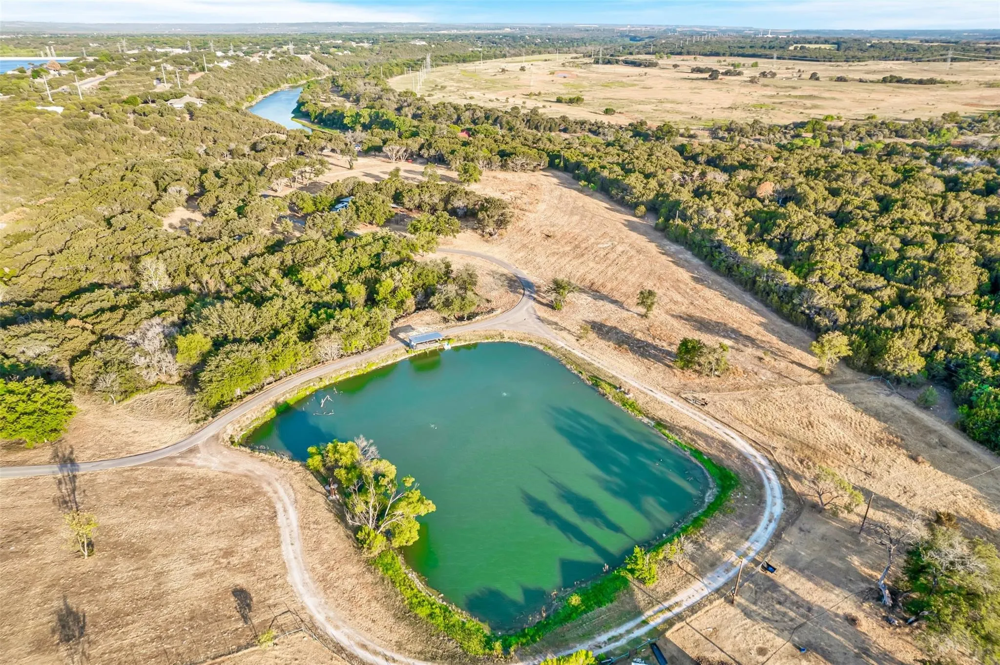 Aerial overview of property's location featuring a large body of water