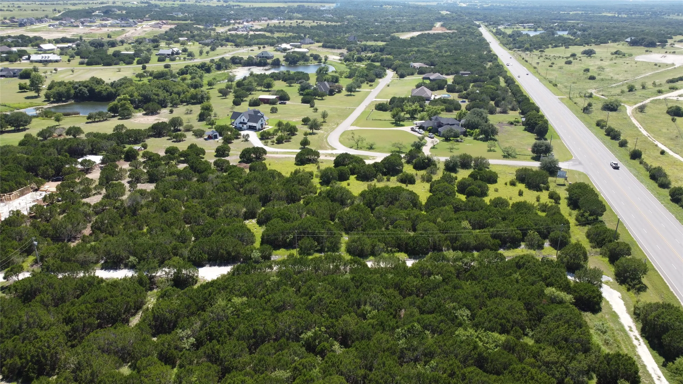 Aerial overview of property's location with a nearby body of water