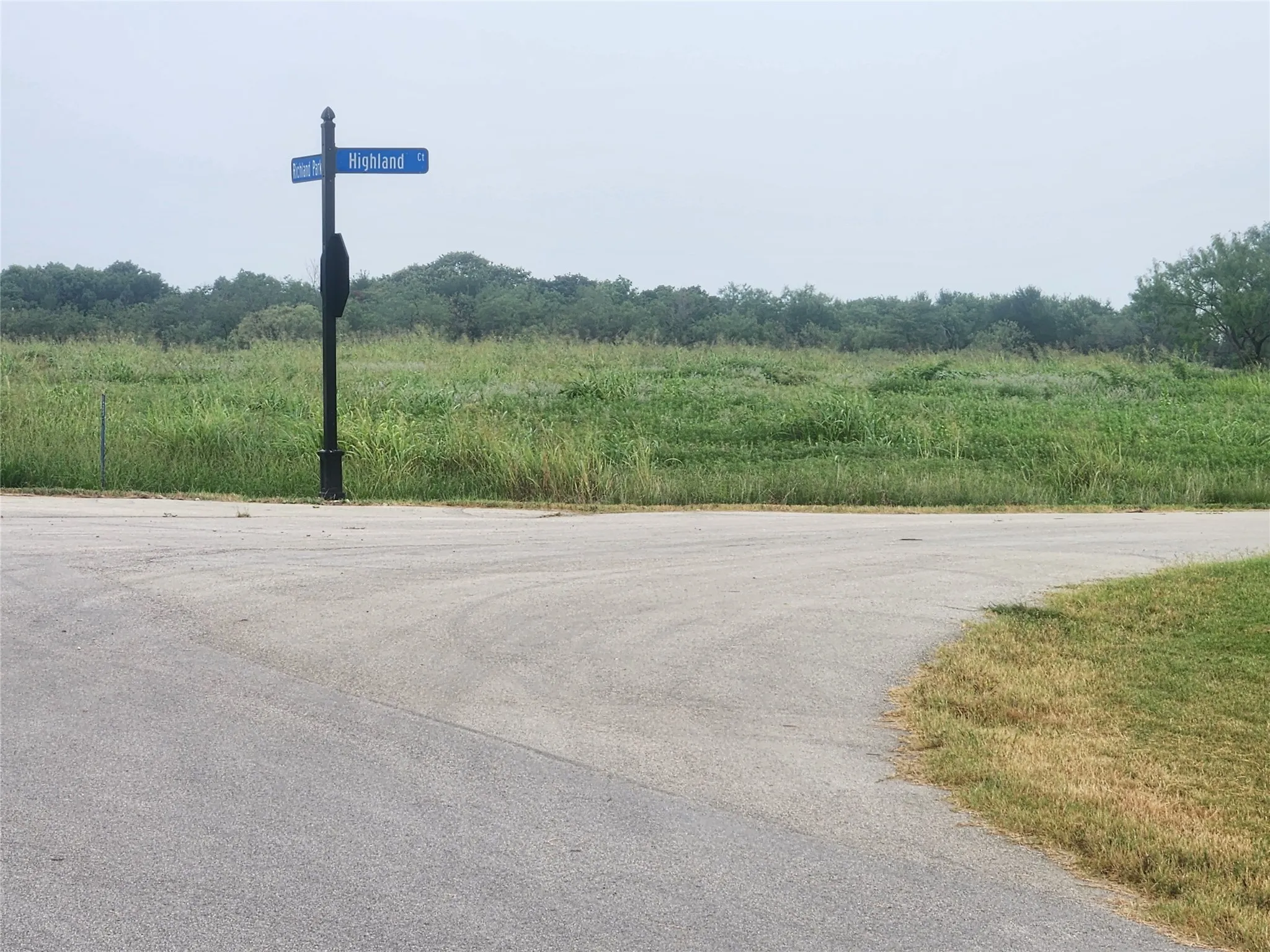 View of asphalt street featuring a rural view
