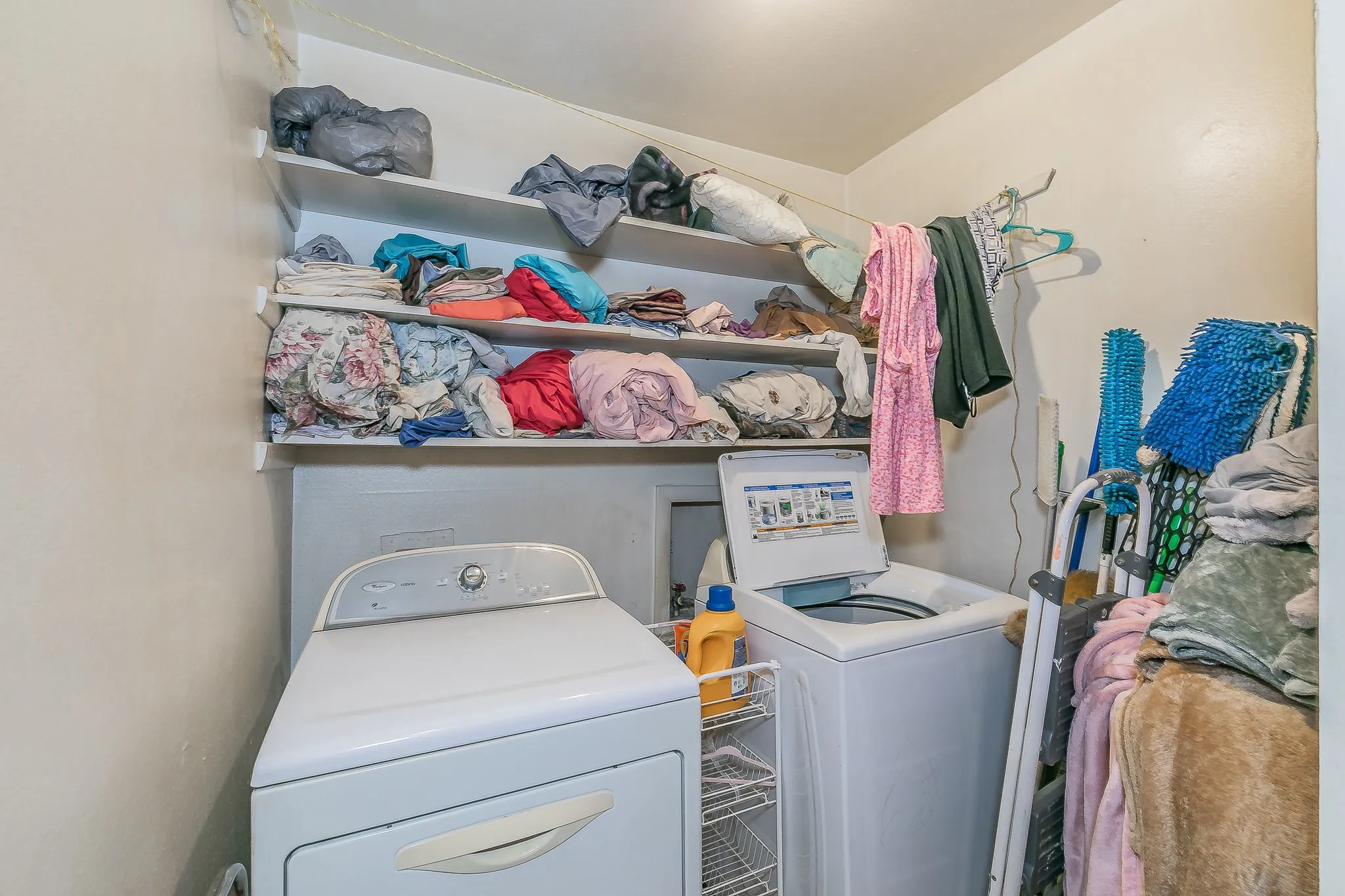 Washroom featuring washing machine and clothes dryer