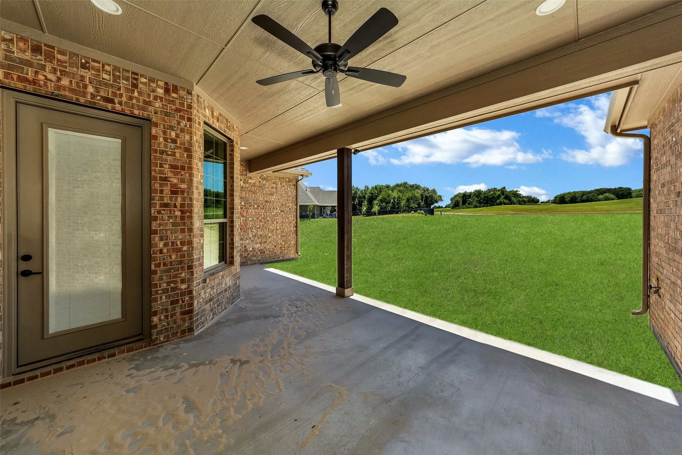 View of patio with a ceiling fan