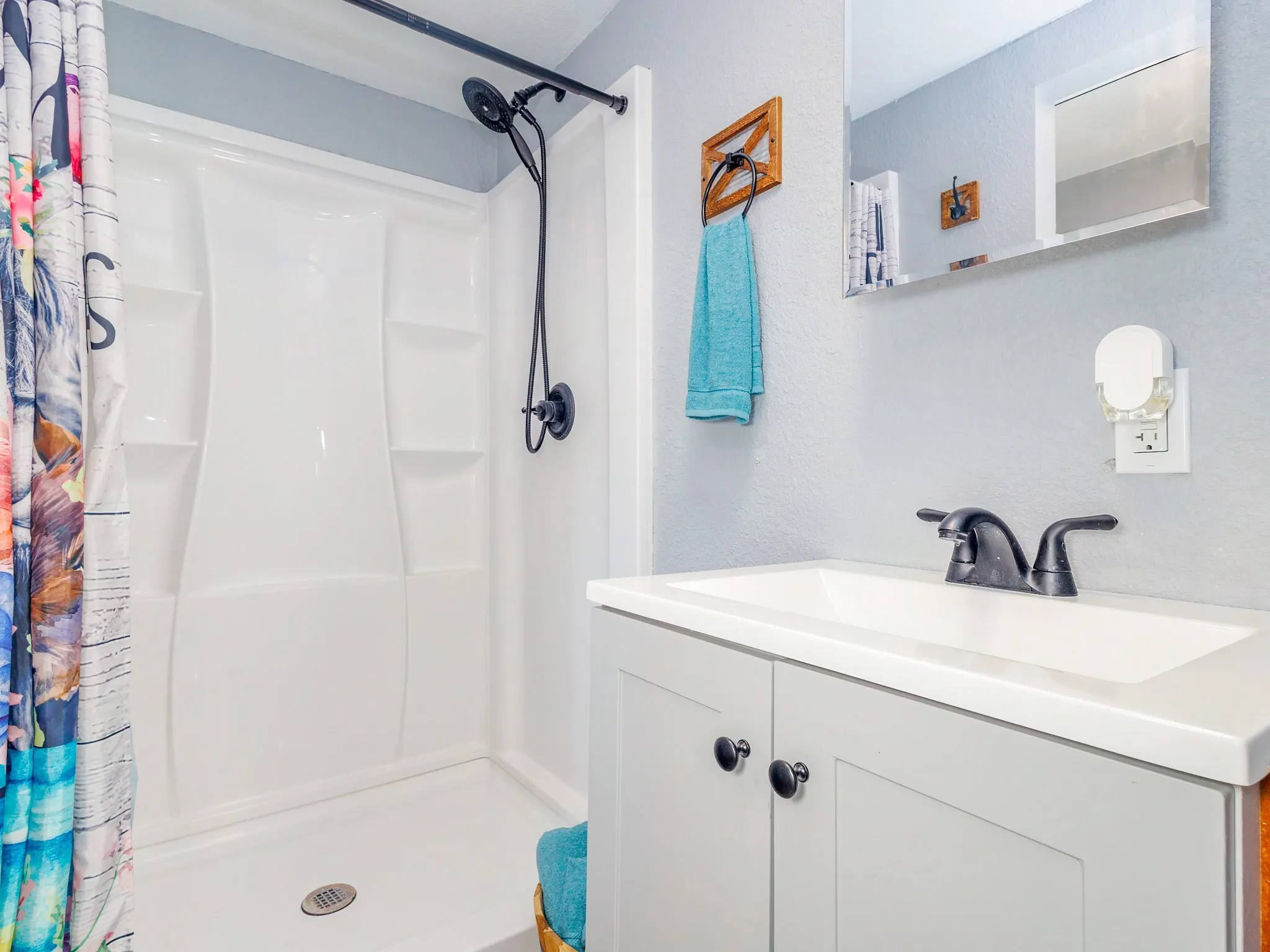 The bathroom is adequately sized, providing enough space for everyday use.