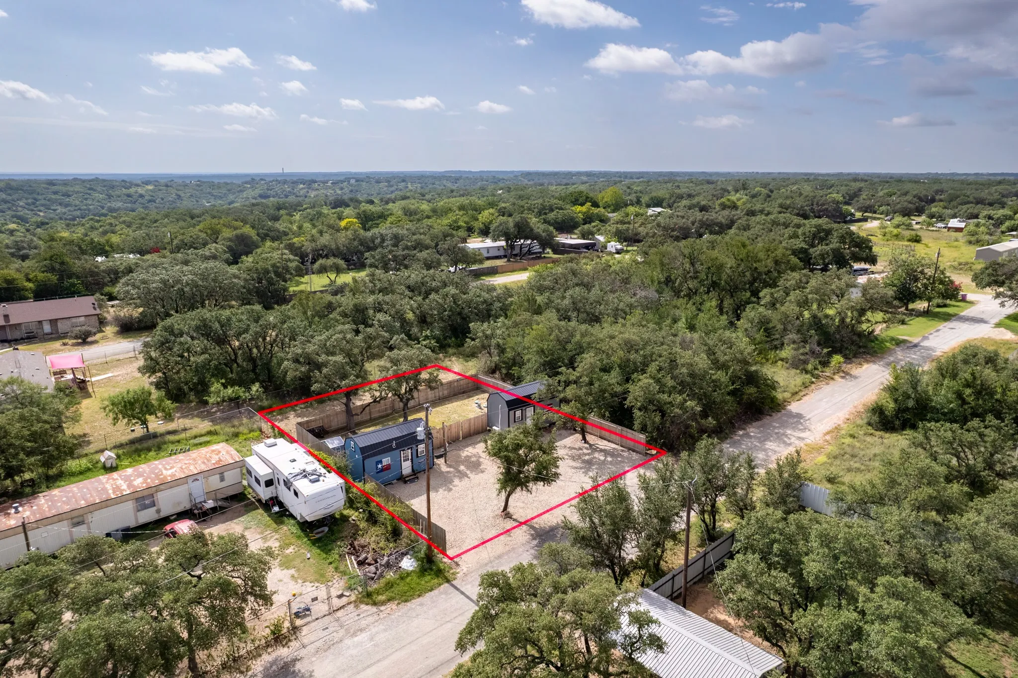 The front yard is low maintenance with gravel landscaping, providing open parking.