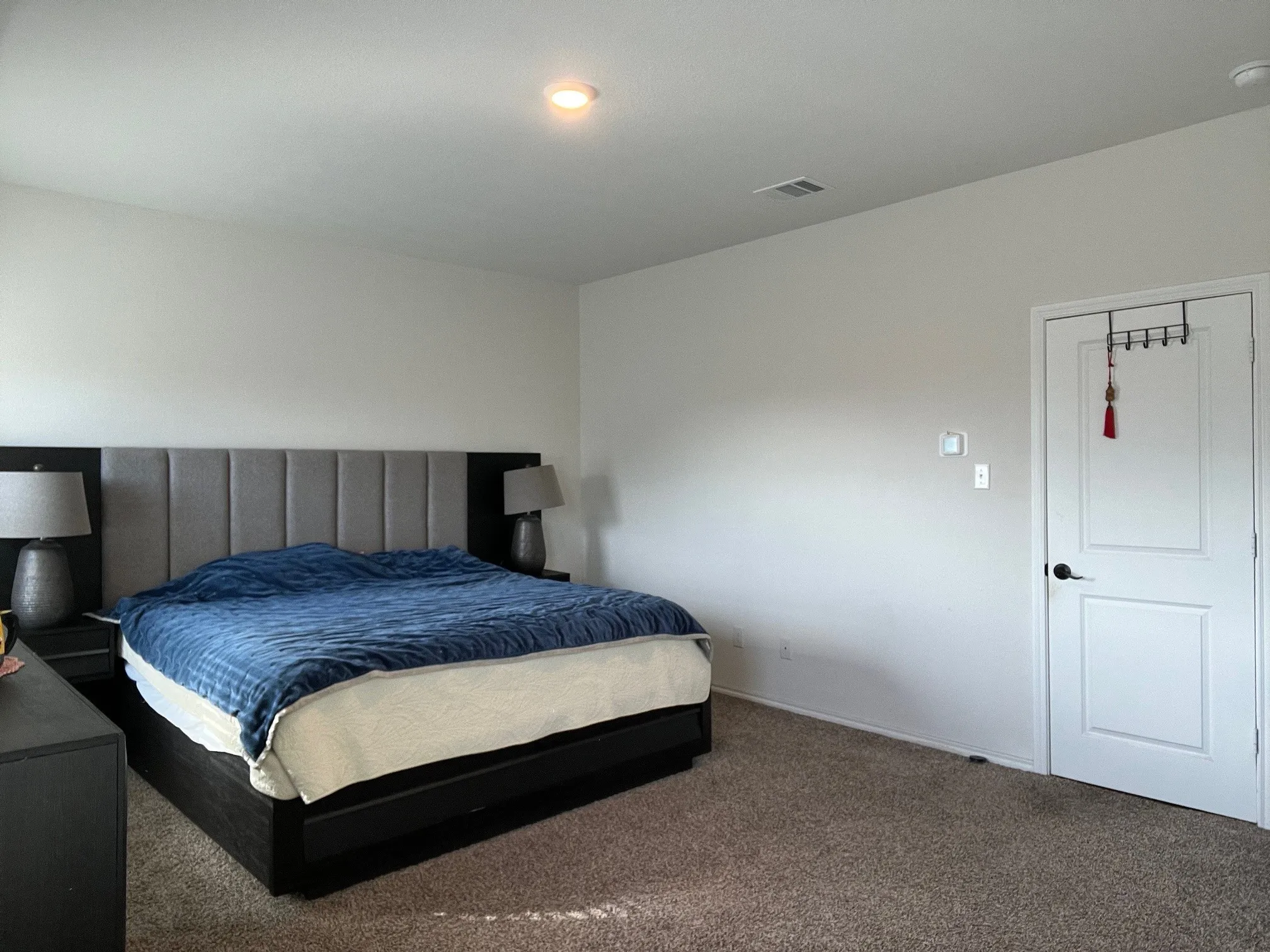 Carpeted bedroom with baseboards