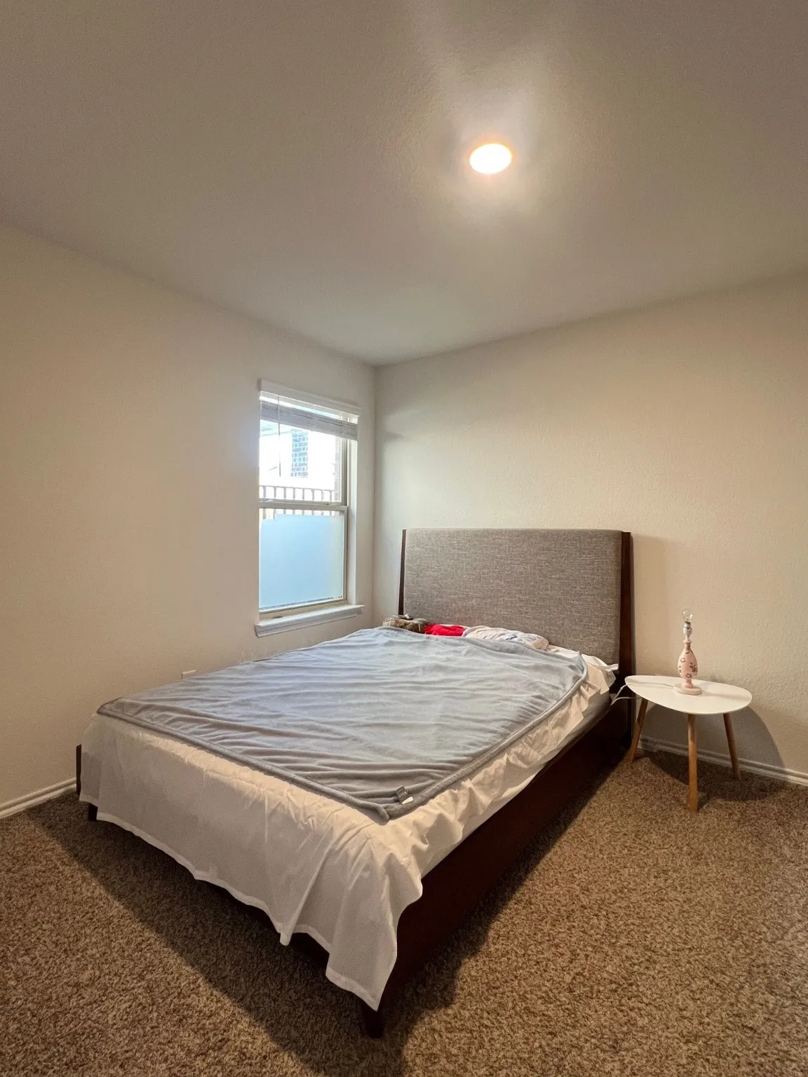 Carpeted bedroom with baseboards