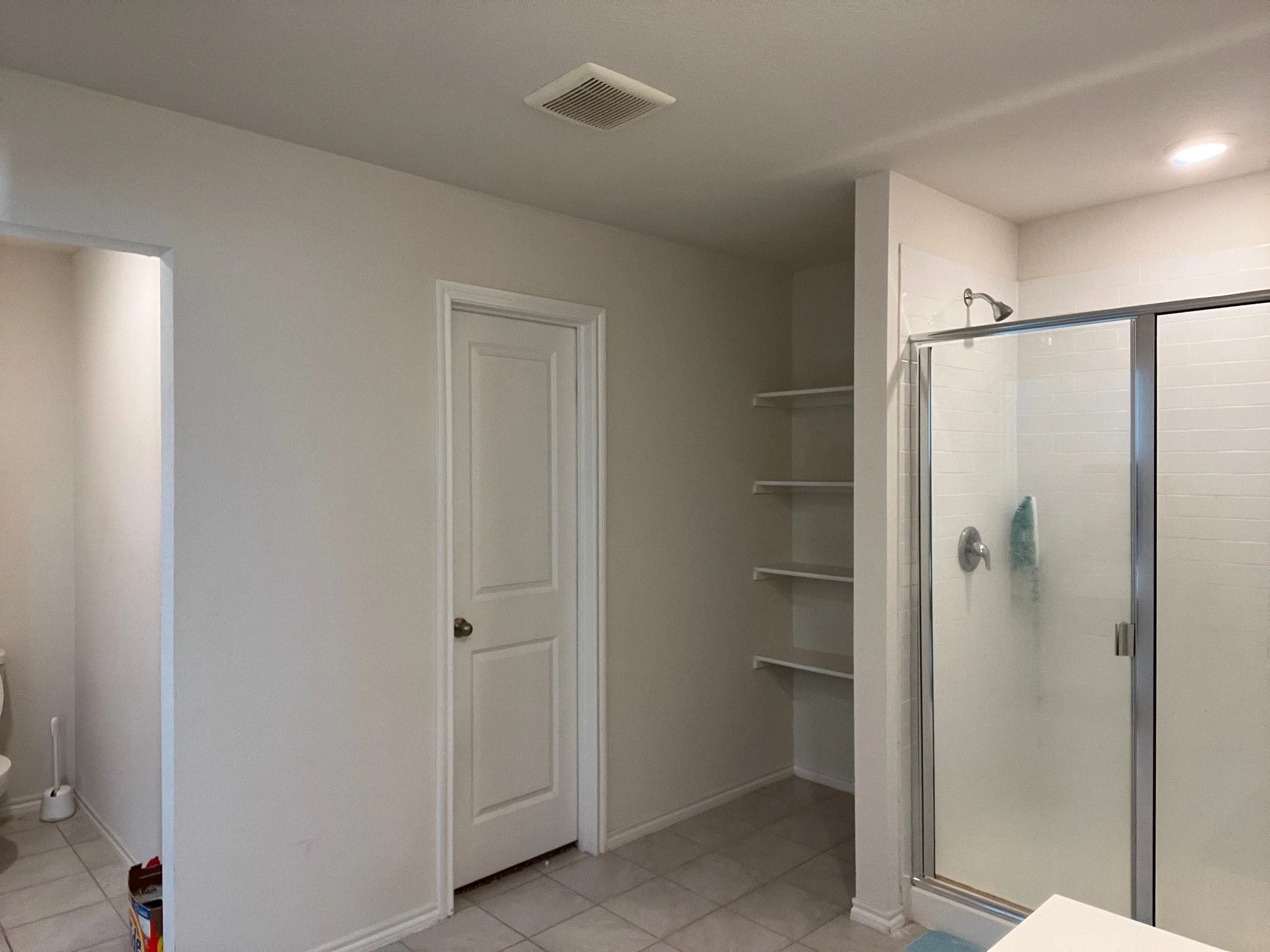 Bathroom featuring a stall shower and tile patterned flooring
