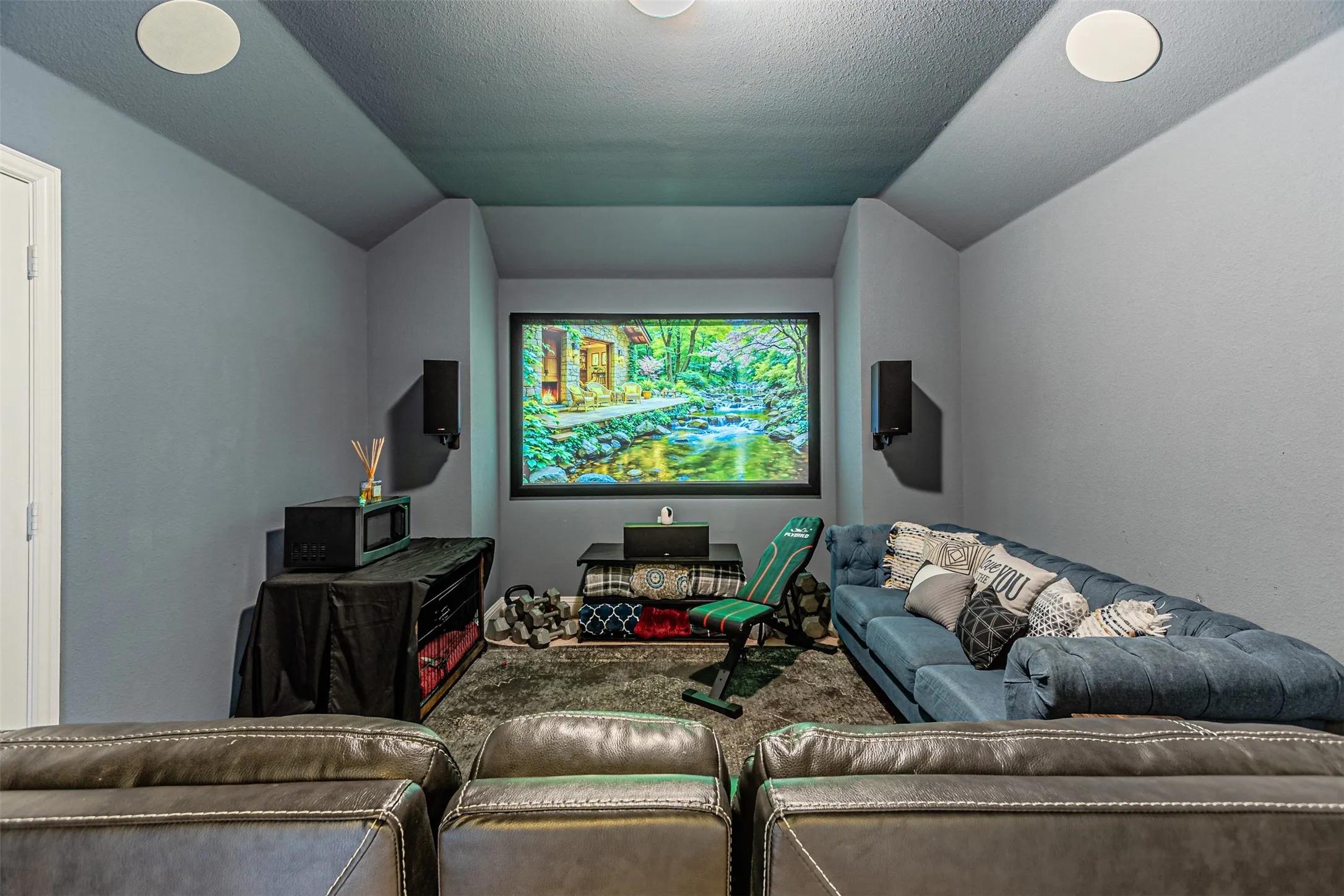Living room featuring a textured ceiling and vaulted ceiling