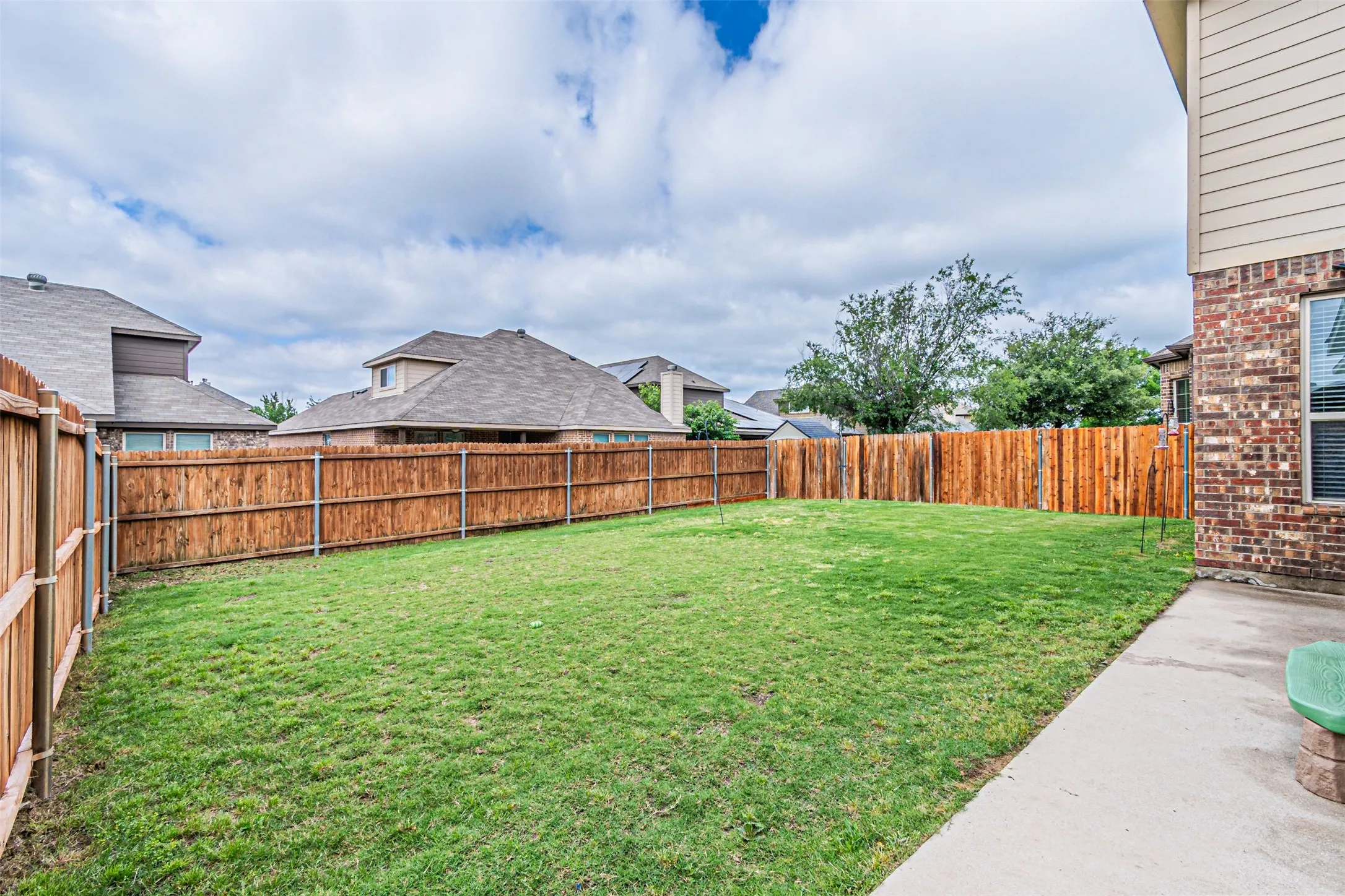 View of fenced backyard