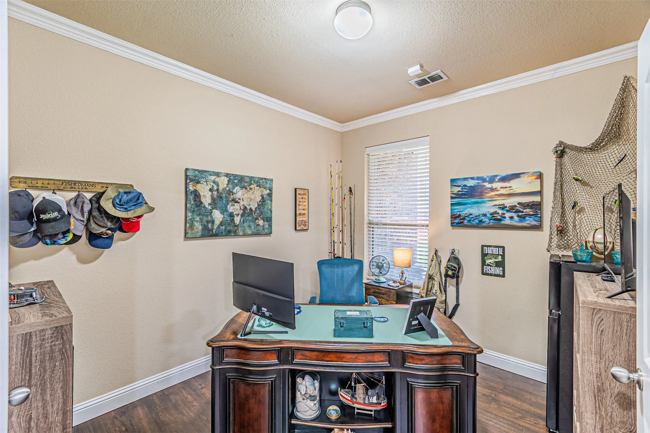 Office featuring dark wood-style floors, ornamental molding, and a textured ceiling