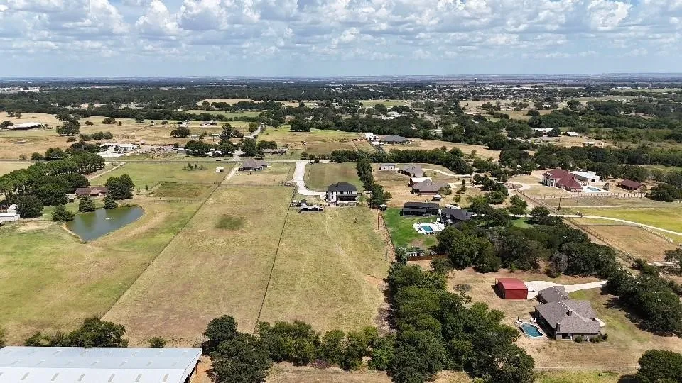Aerial overview of property's location featuring a large body of water and rural landscape