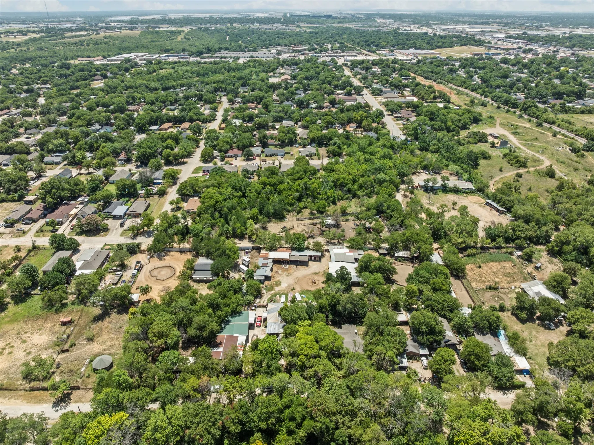 Aerial view of residential area with a tree filled landscape
